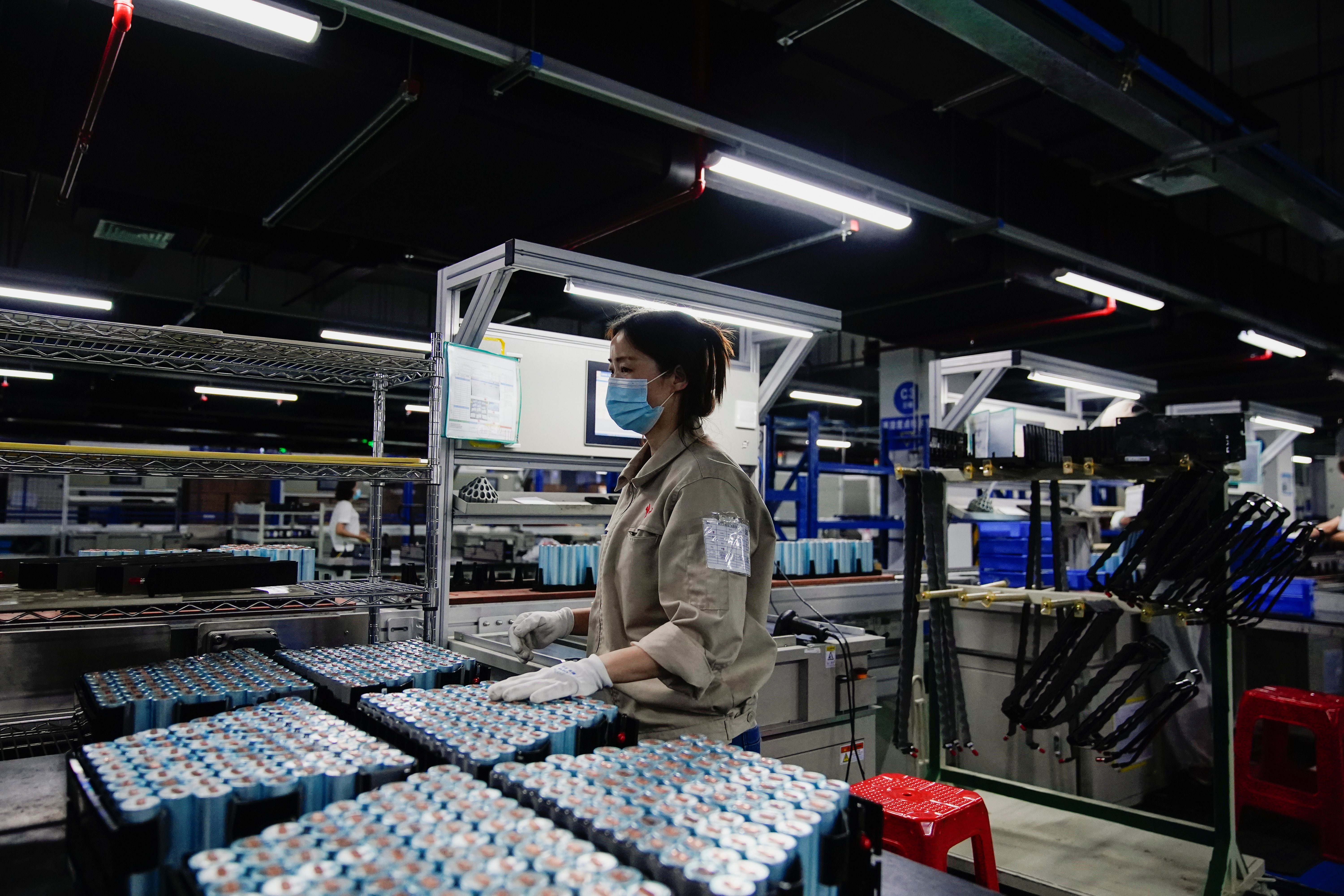 An employee works on the production line of electric vehicle (EV) battery manufacturer Octillion in Hefei,