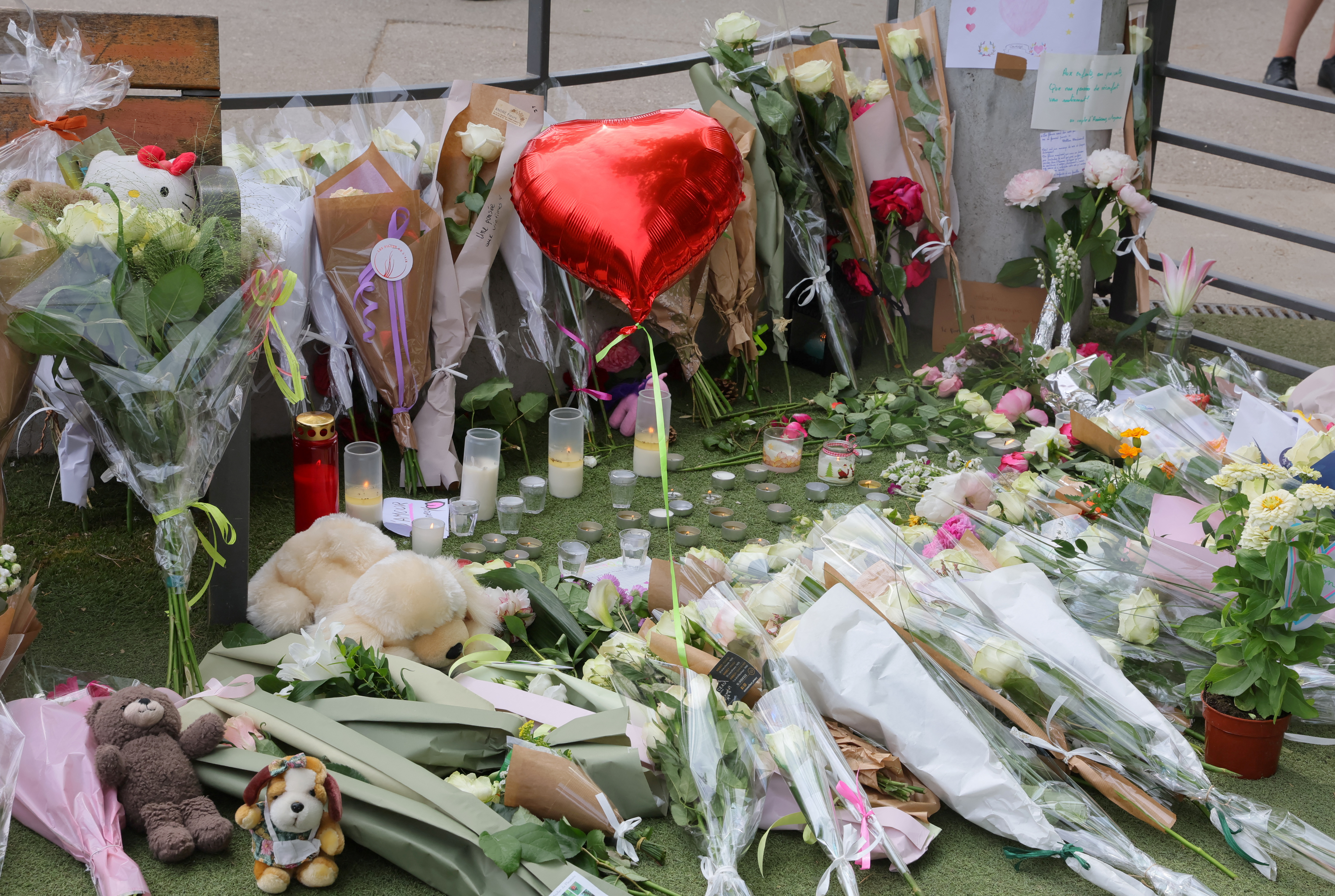 Tribute for victims the day after knife attack in French alpine town of Annecy