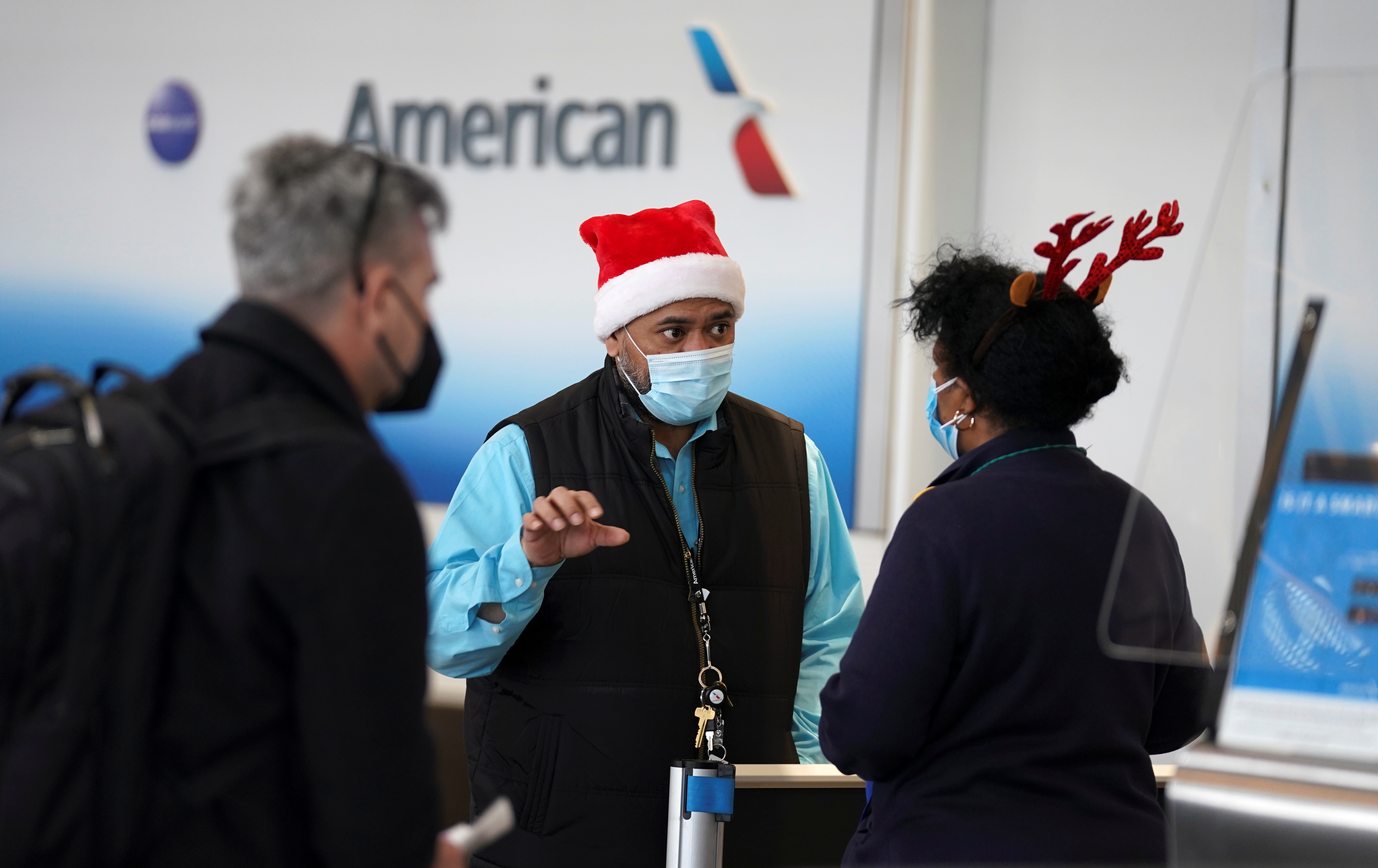 Airline workers in Christmas themed headwear at Ronald Reagan Washington National Airport, in Arlington, Virginia