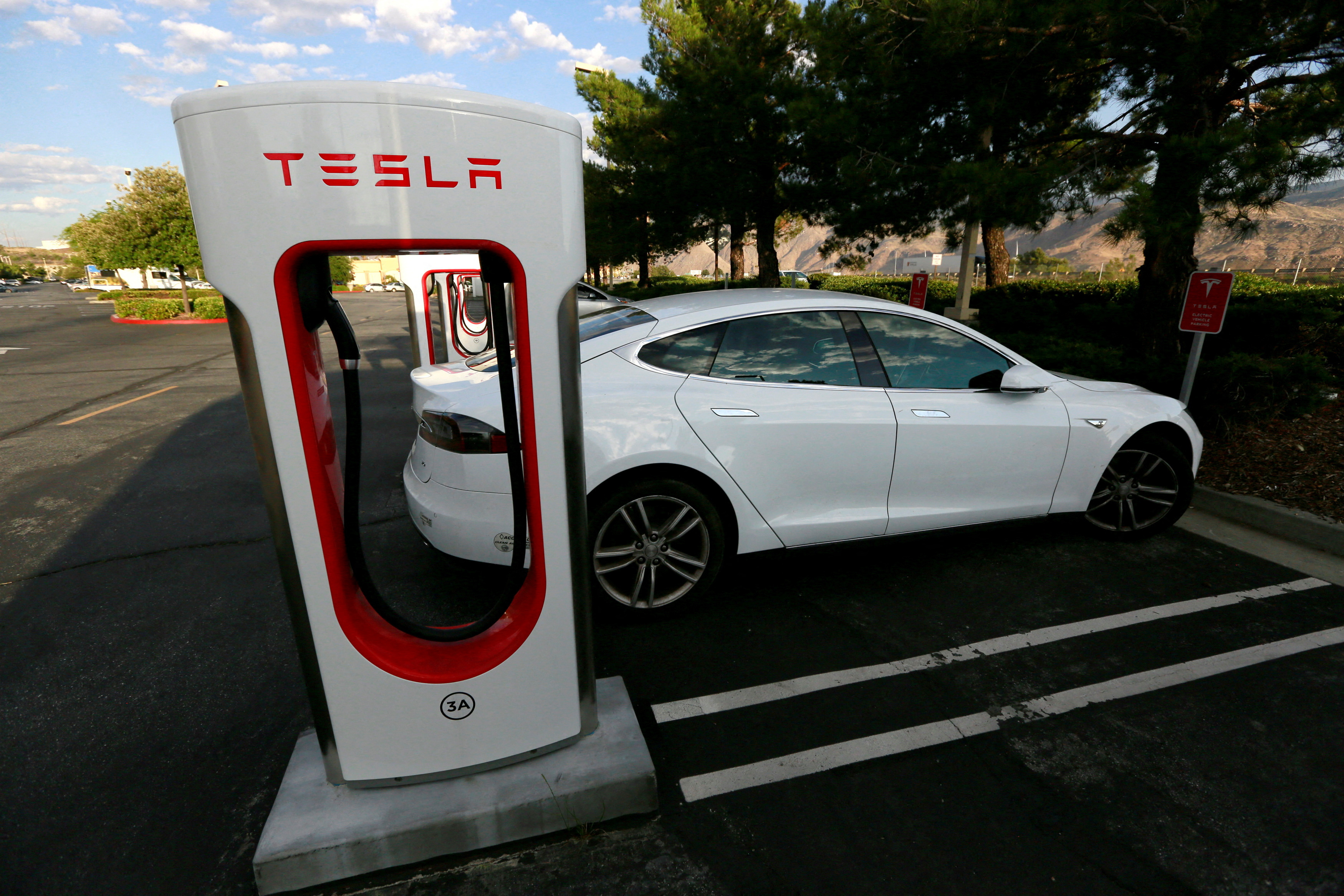 A Tesla Model S charges at a Tesla supercharger station in Cabazon, California