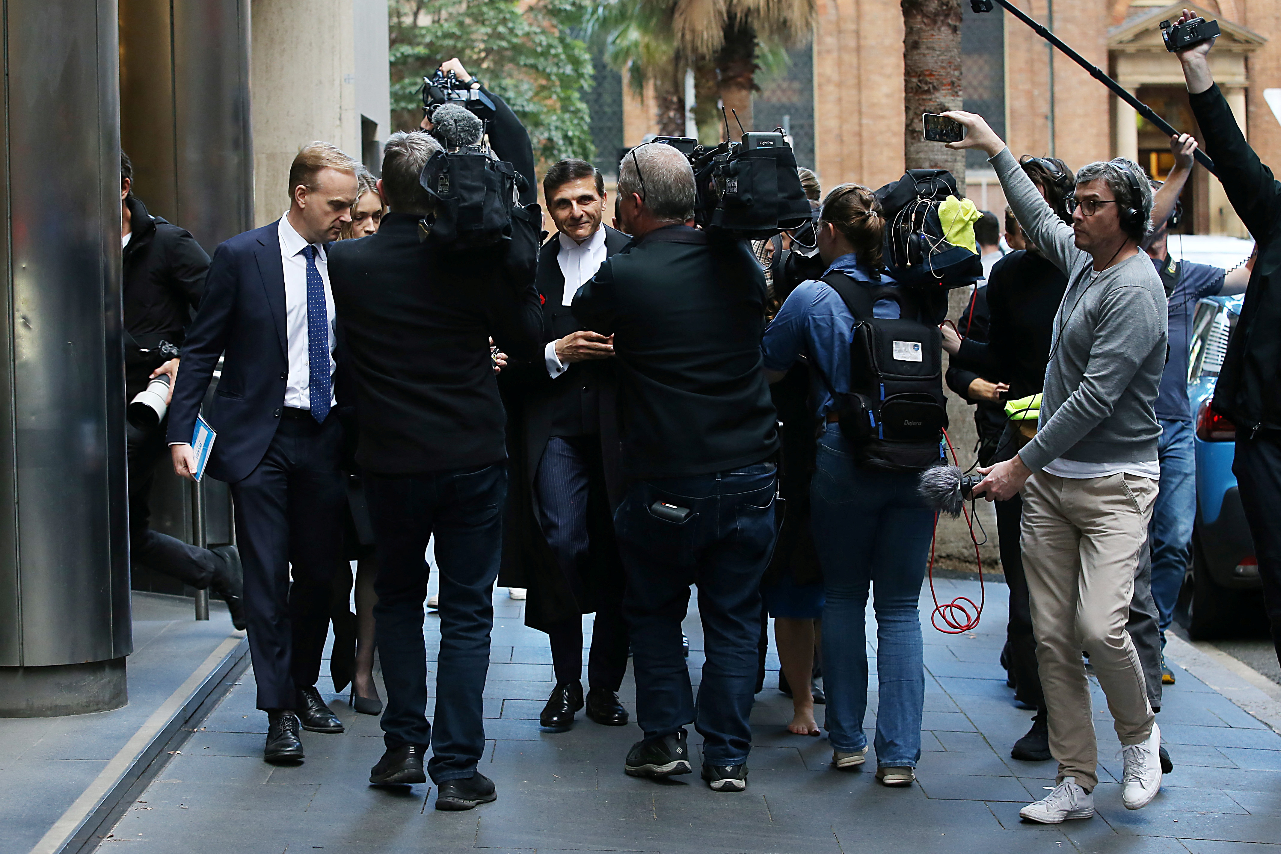 Media surround Arthur Moses SC, lawyer of Ben Roberts-Smith, as he leaves the Federal Court