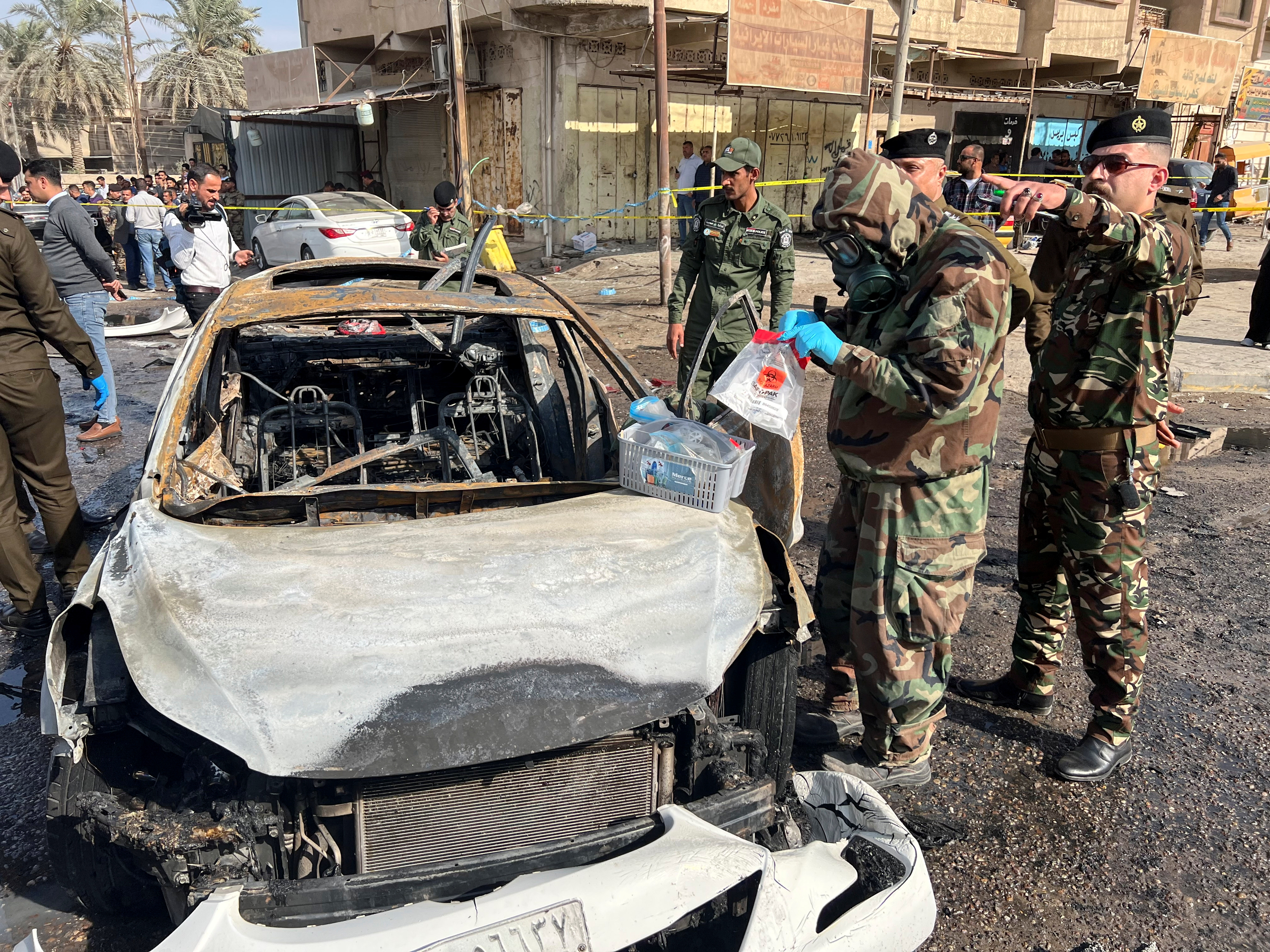 Iraqi security forces inspect site of explosion in Basra