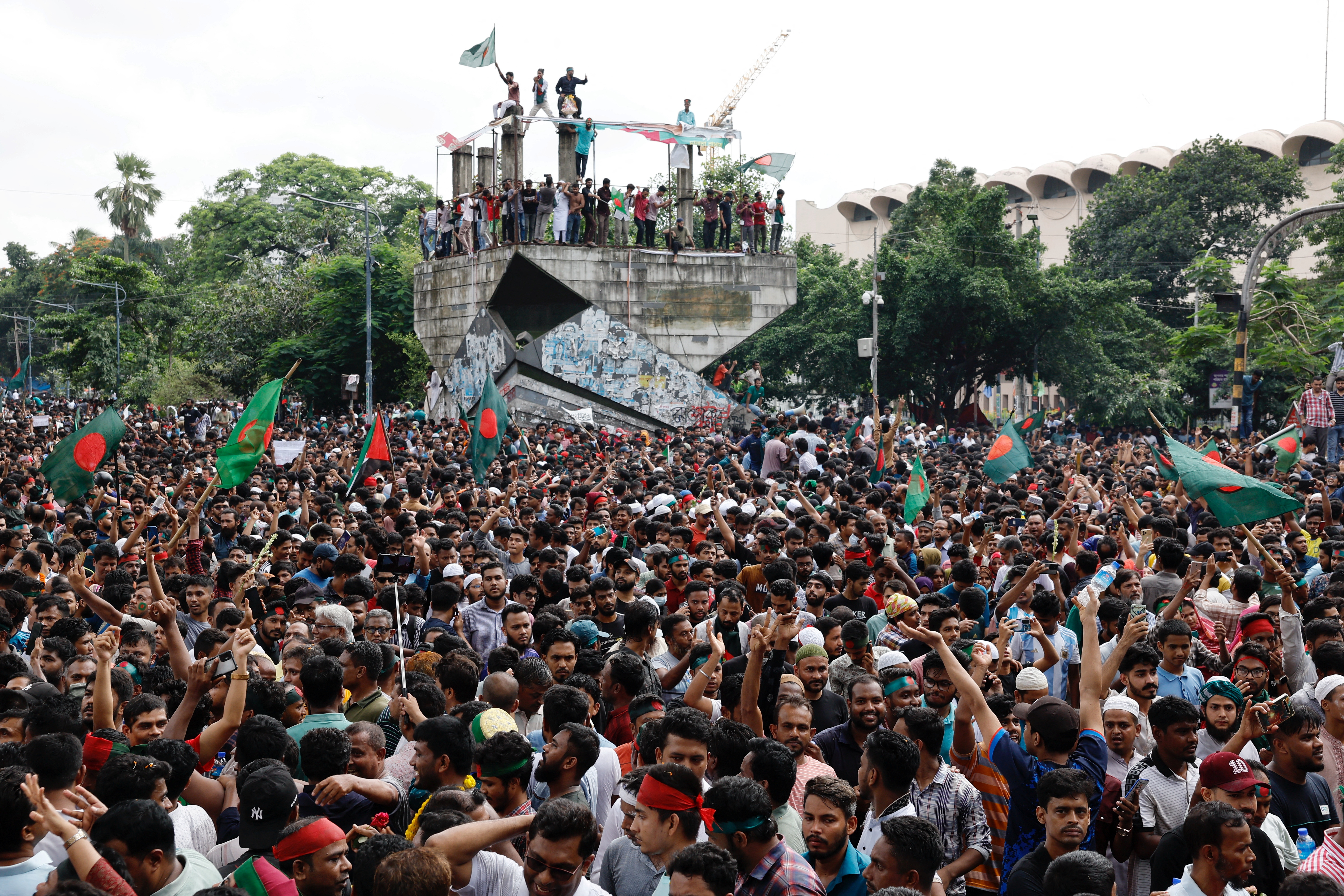 People celebrate the resignation of Bangladeshi Prime Minister Hasina in Dhaka