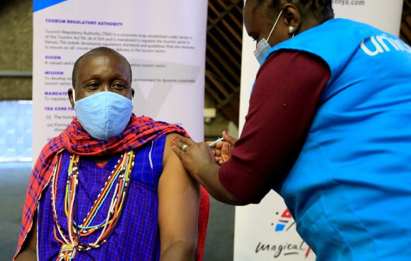Kenyan tour guide Daniel Ole Kissipan receives the AstraZeneca/Oxford vaccine under the COVAX scheme in Nairobi
