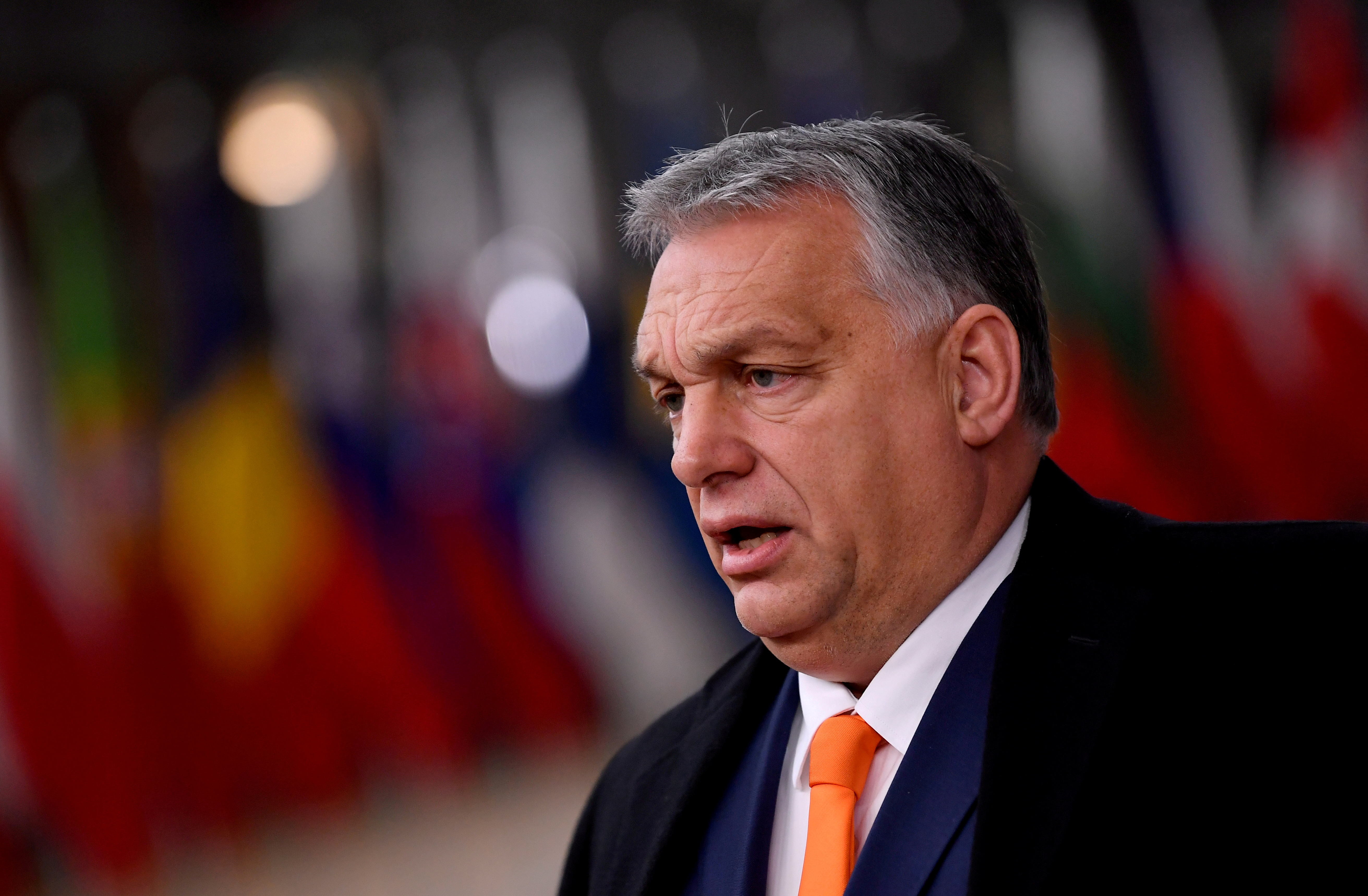 Hungary's Prime Minister Viktor Orban speaks on arrival for an EU summit in Brussels