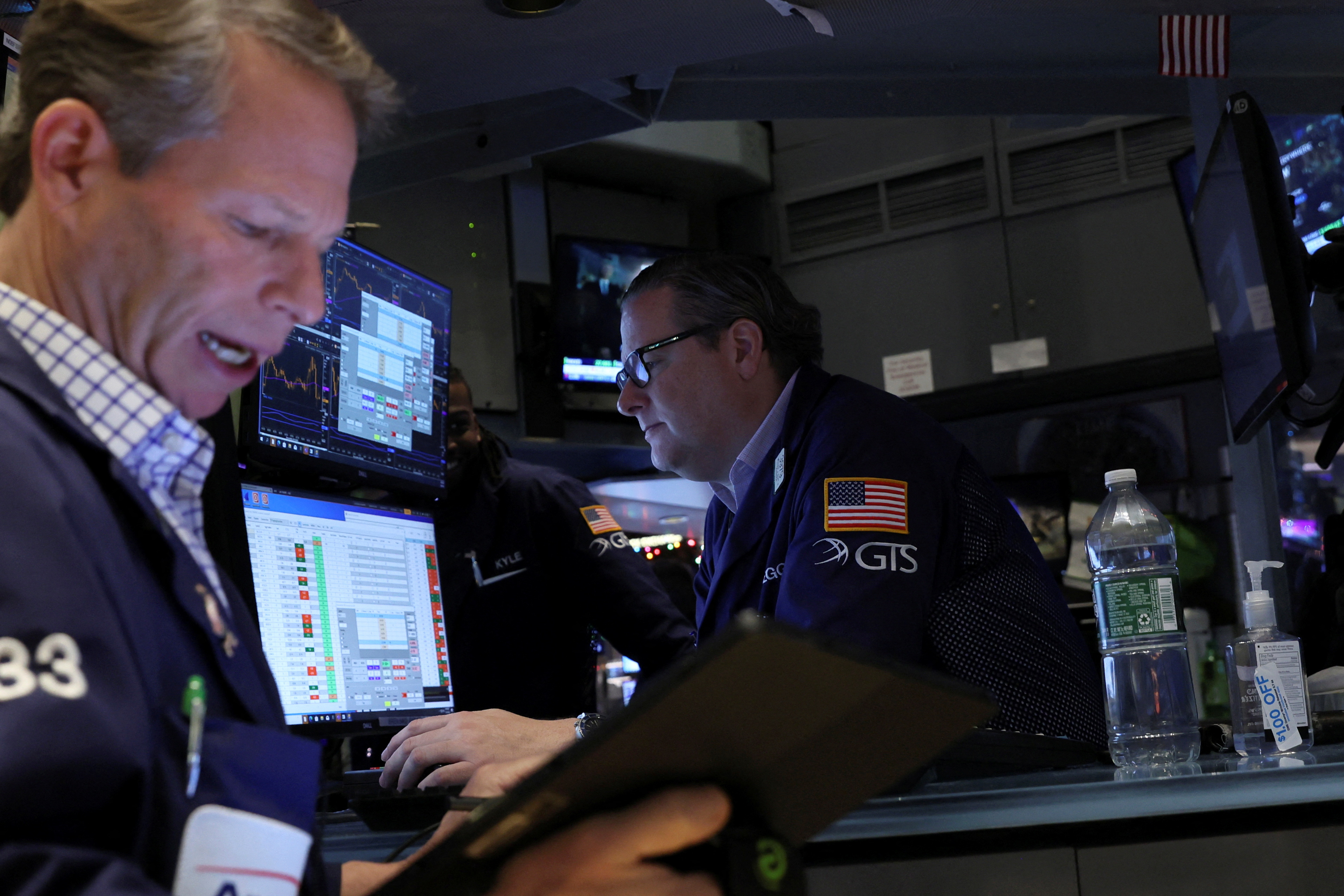 Traders operate on the floor of the NYSE in New York
