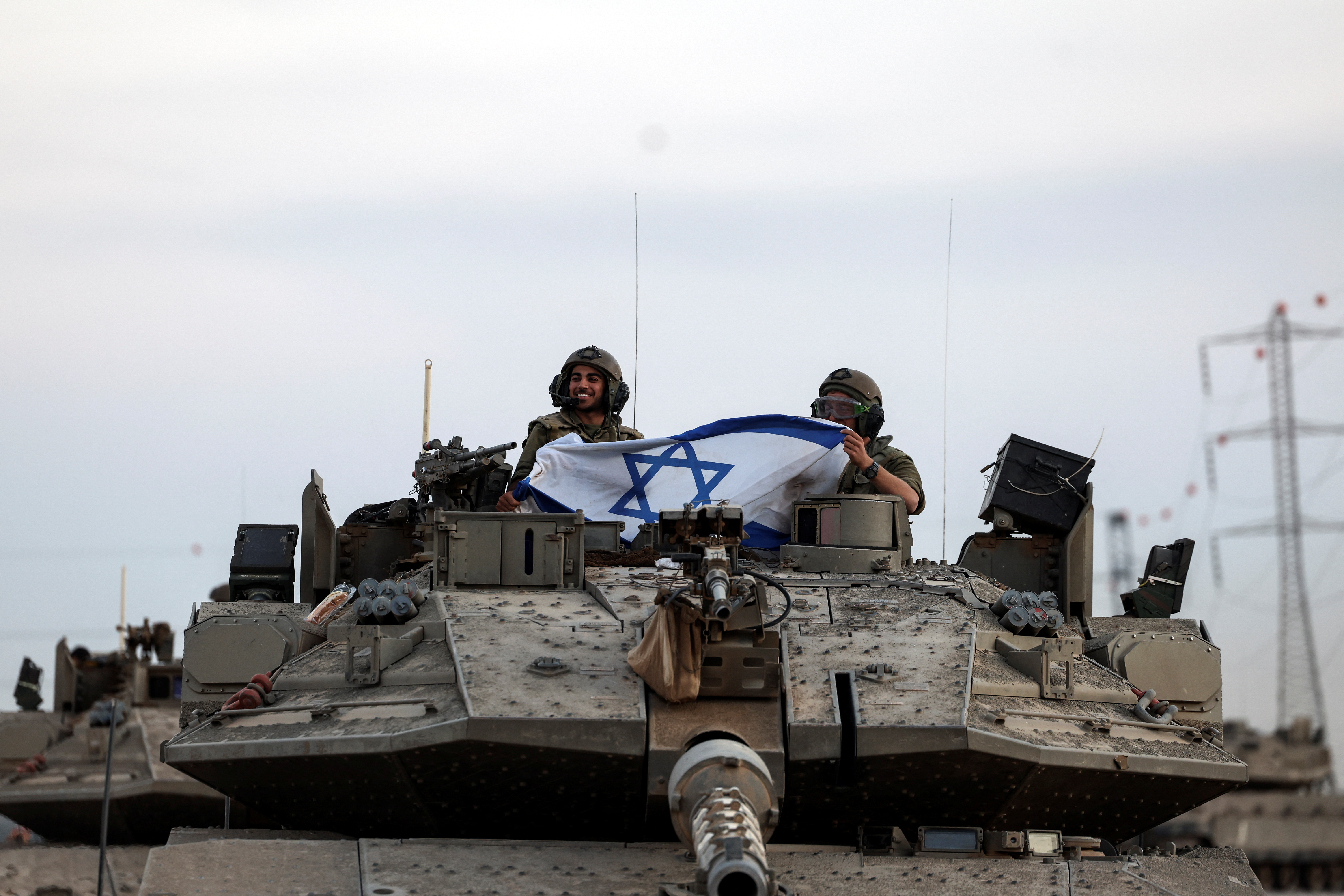 Israeli soldiers bring tanks near Gaza Strip