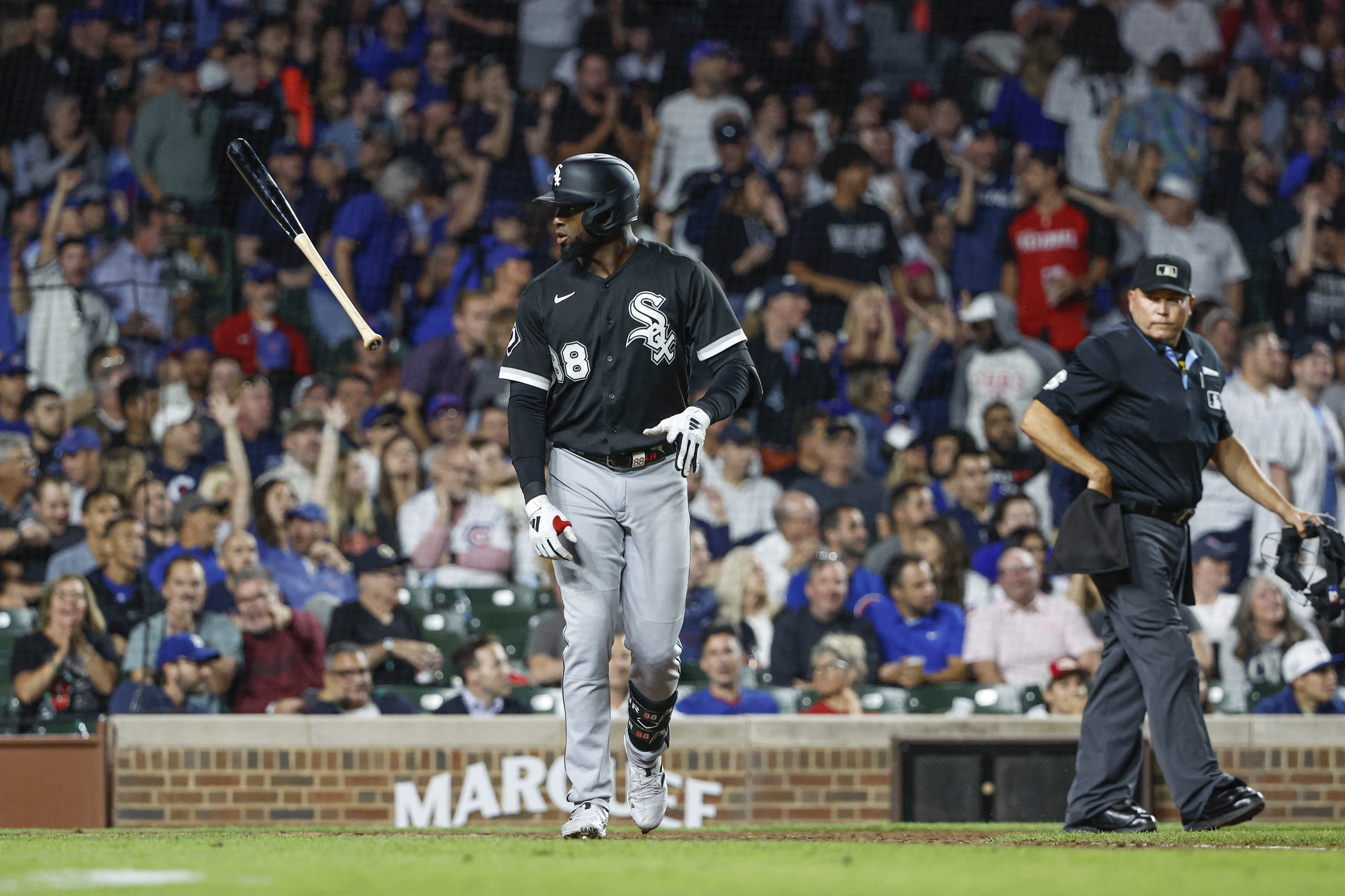 Luis Robert Jr. #88 of the Chicago White Sox runs back to the