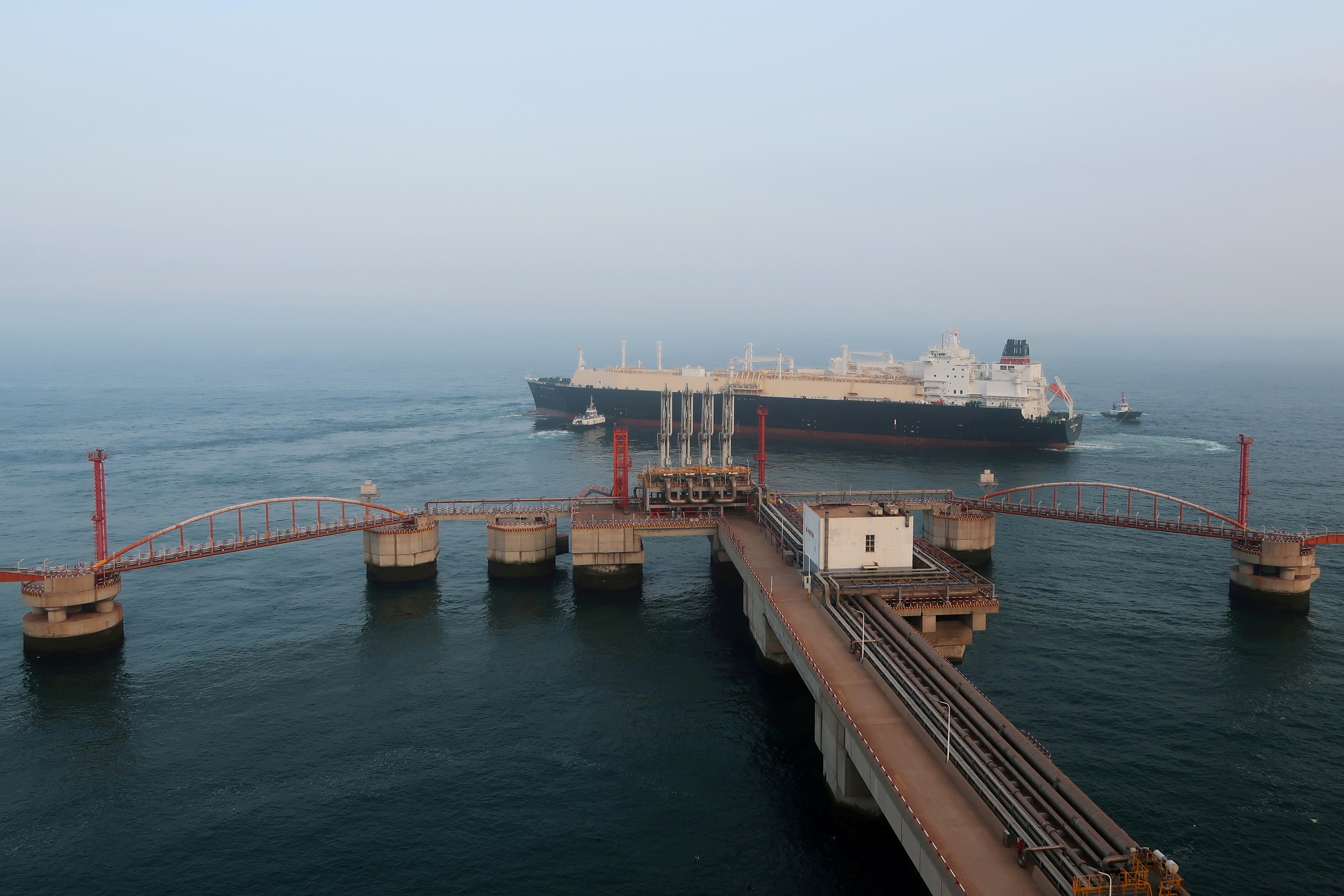A liquified natural gas (LNG) tanker leaves the dock after discharge at PetroChina's receiving terminal in Dalian