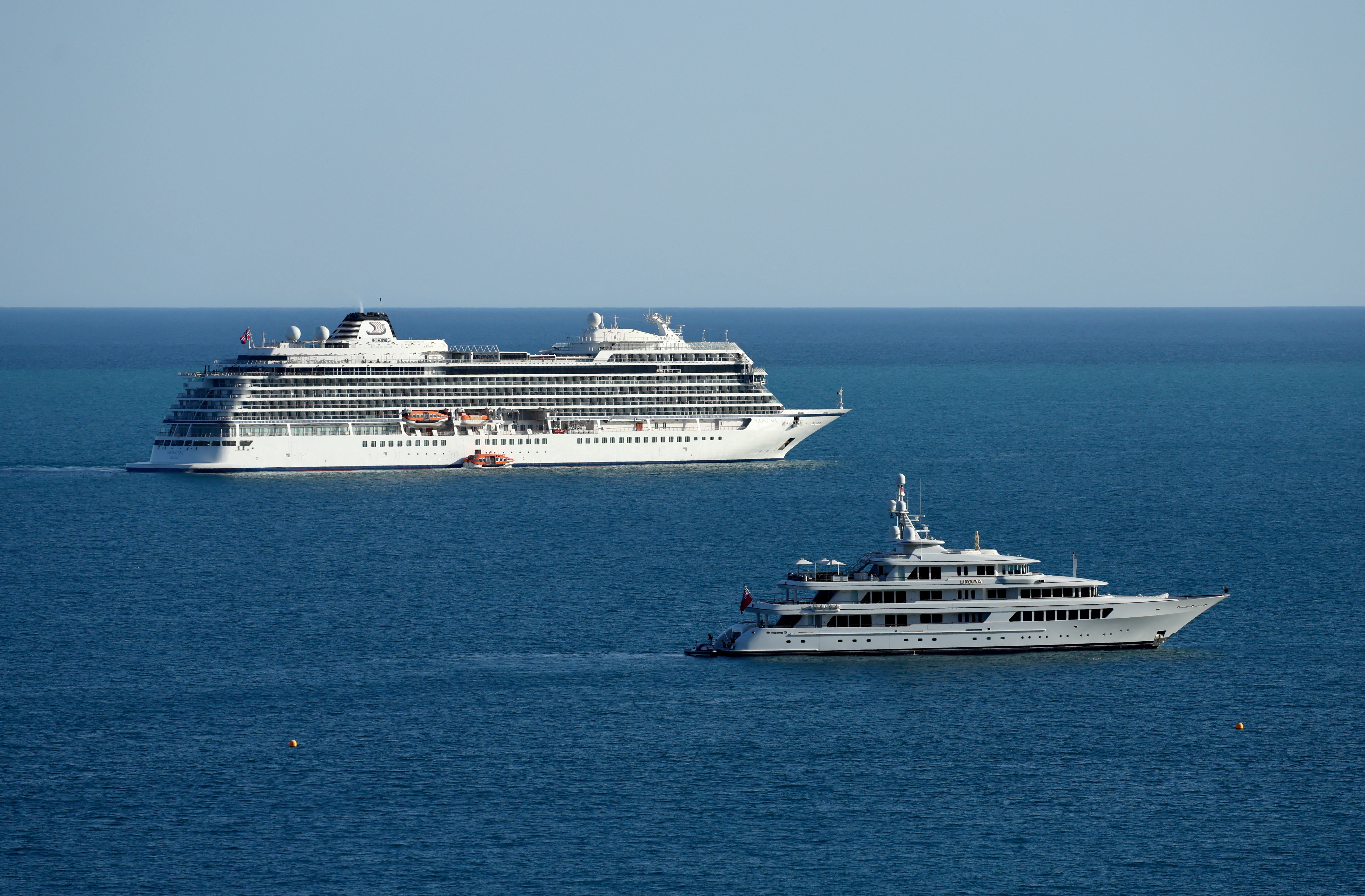 The Viking Sea cruise ship and the Utopia yacht are seen on the Mediterranean Sea in front of Monte Carlo in Roquebrune-Cap-Martin
