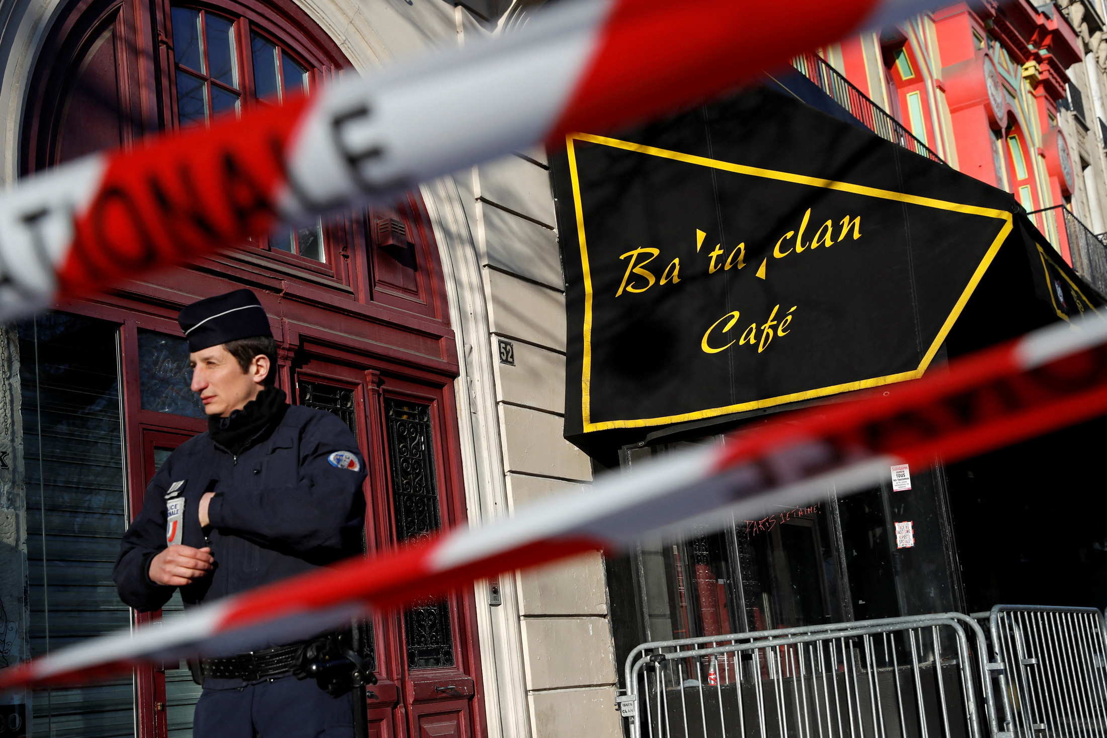 French police block the access to the Bataclan concert hall before the visit of members of a committee investigating government measures to fight shooting and bombing attacks at the site four months after a series of attacks at several sites in