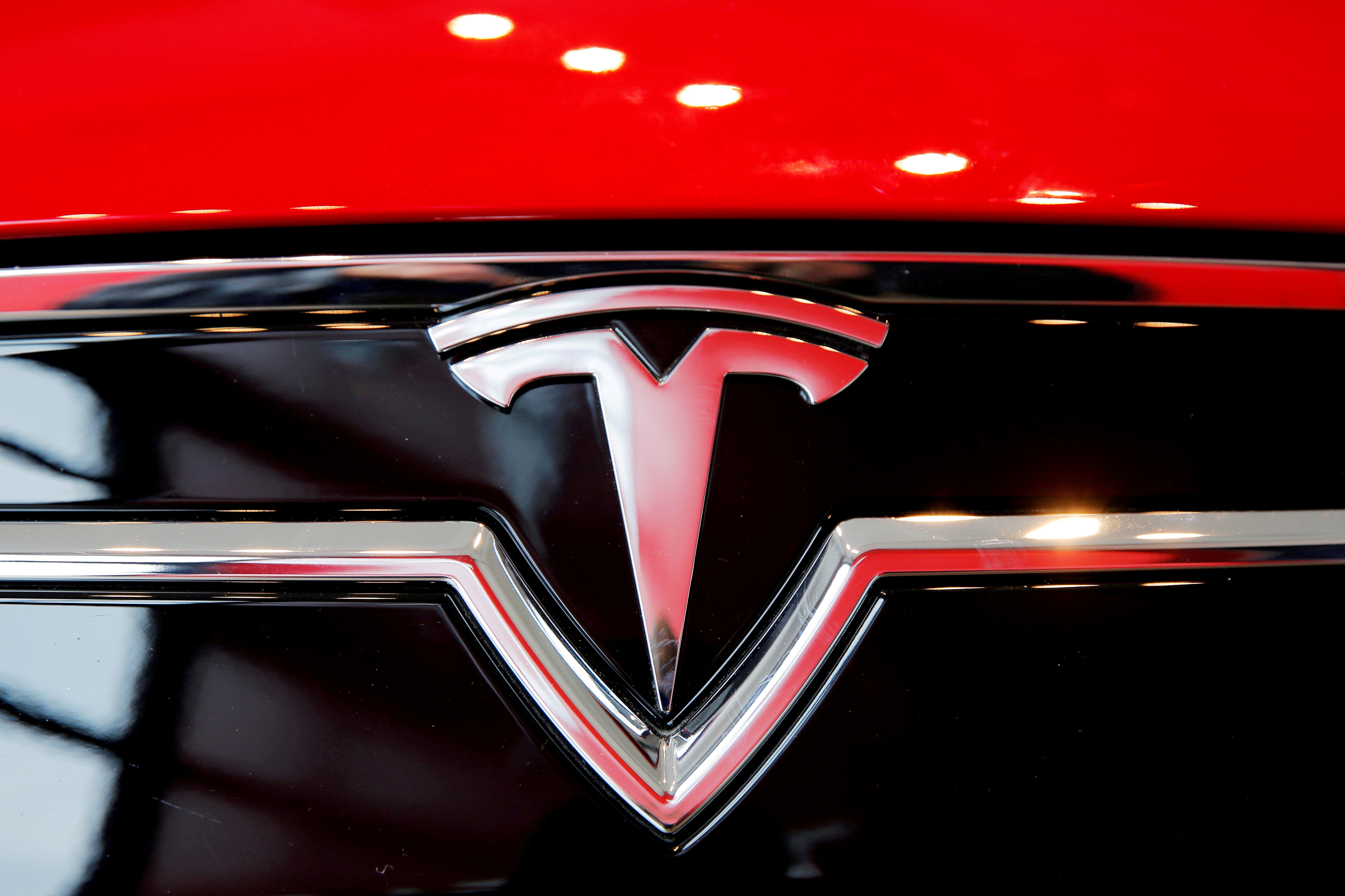A Tesla logo on a Model S is photographed inside of a Tesla dealership in New York, U.S., April 29, 2016. REUTERS/Lucas Jackson/File Photo/File Photo