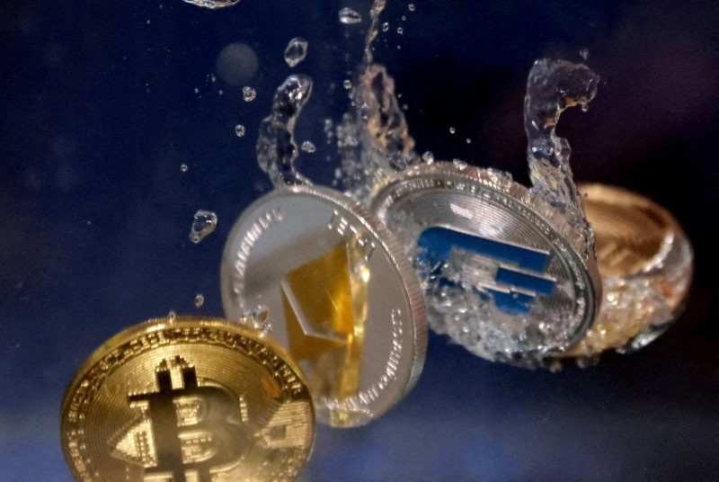 Illustration shows representation of cryptocurrencies plunging into water