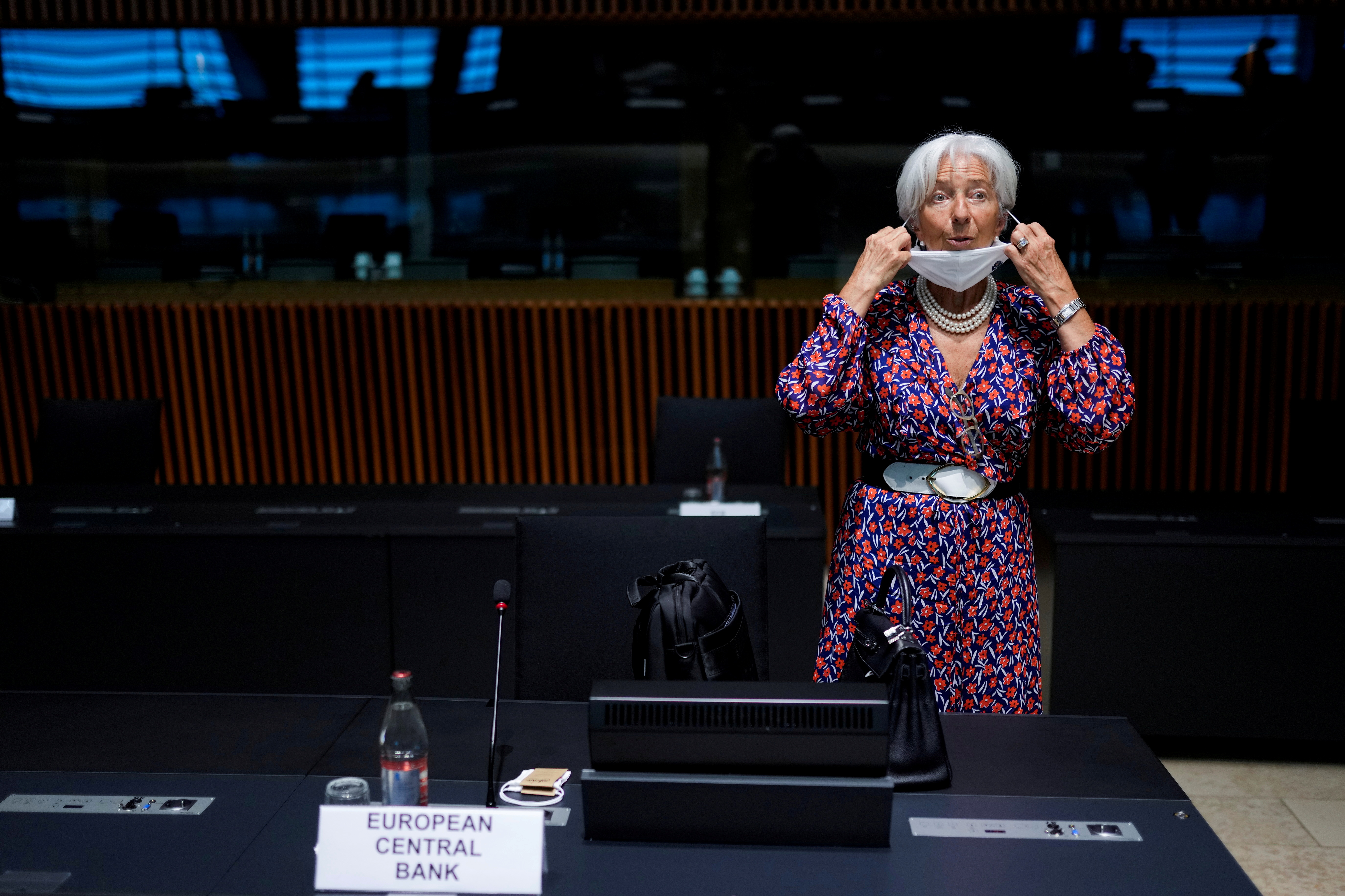 European Central Bank President Christine Lagarde adjusts her protective face mask as she arrives at a meeting of Eurogroup Finance Ministers at the European Council building in Luxembourg, Luxembourg June 17, 2021. Francisco Seco/Pool via REUTERS