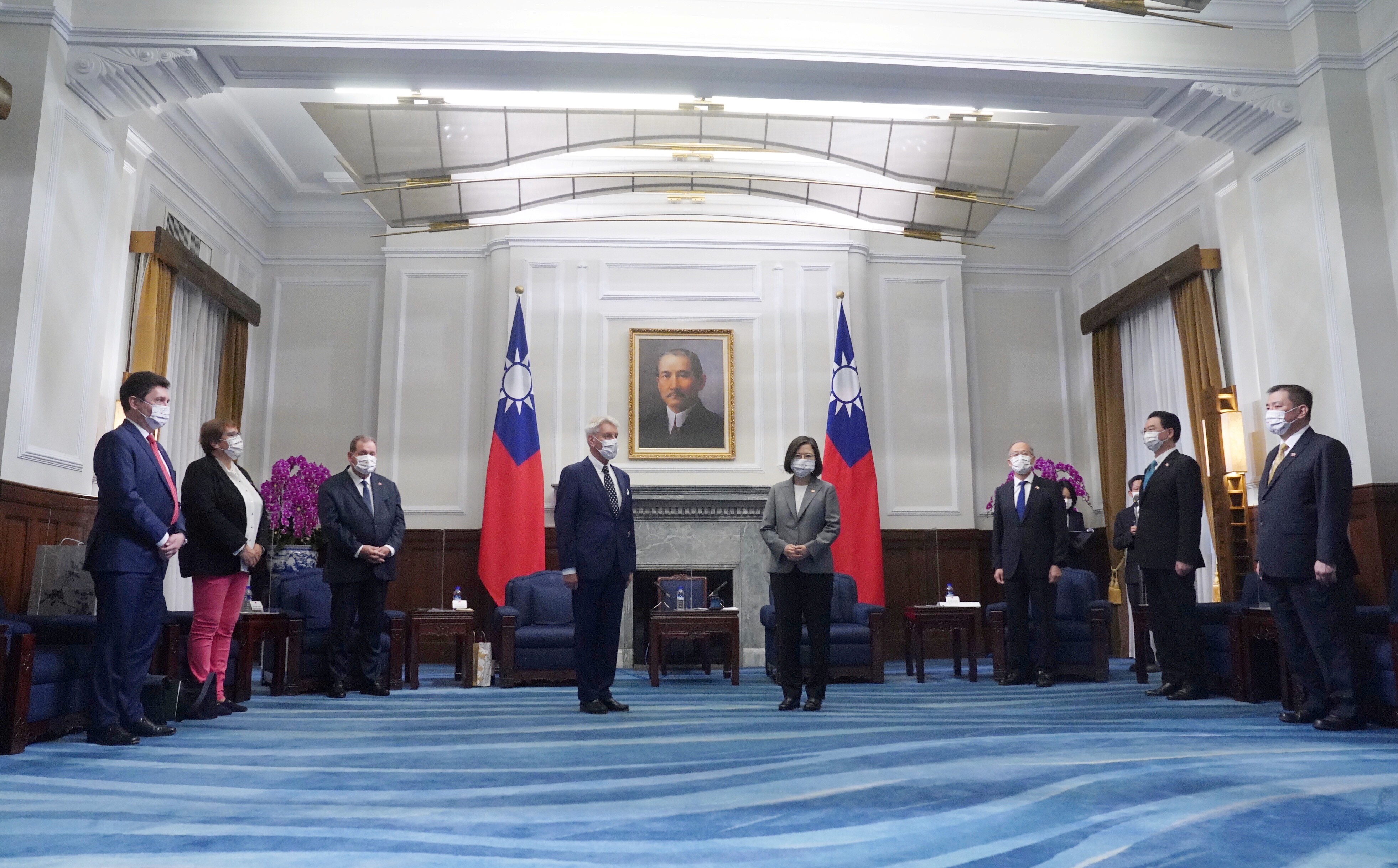 Taiwan's President Tsai Ing-wen stands next to French Senator Alain Richard during their meeting in Taipei