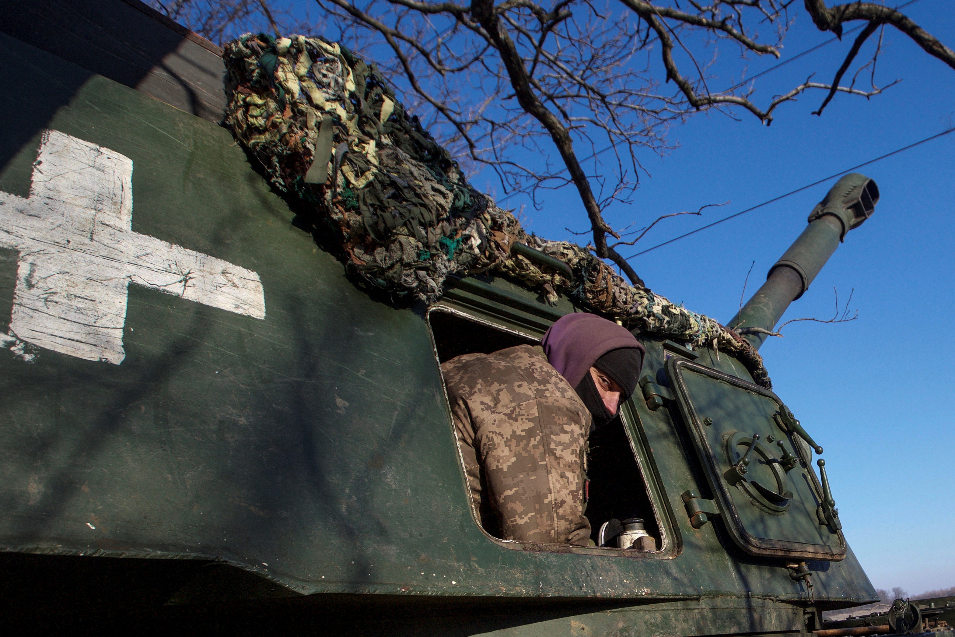 Ukrainian serviceman is seen inside a 2S3 Akatsiya self-propelled howitzer at a position in a frontline in Donetsk region