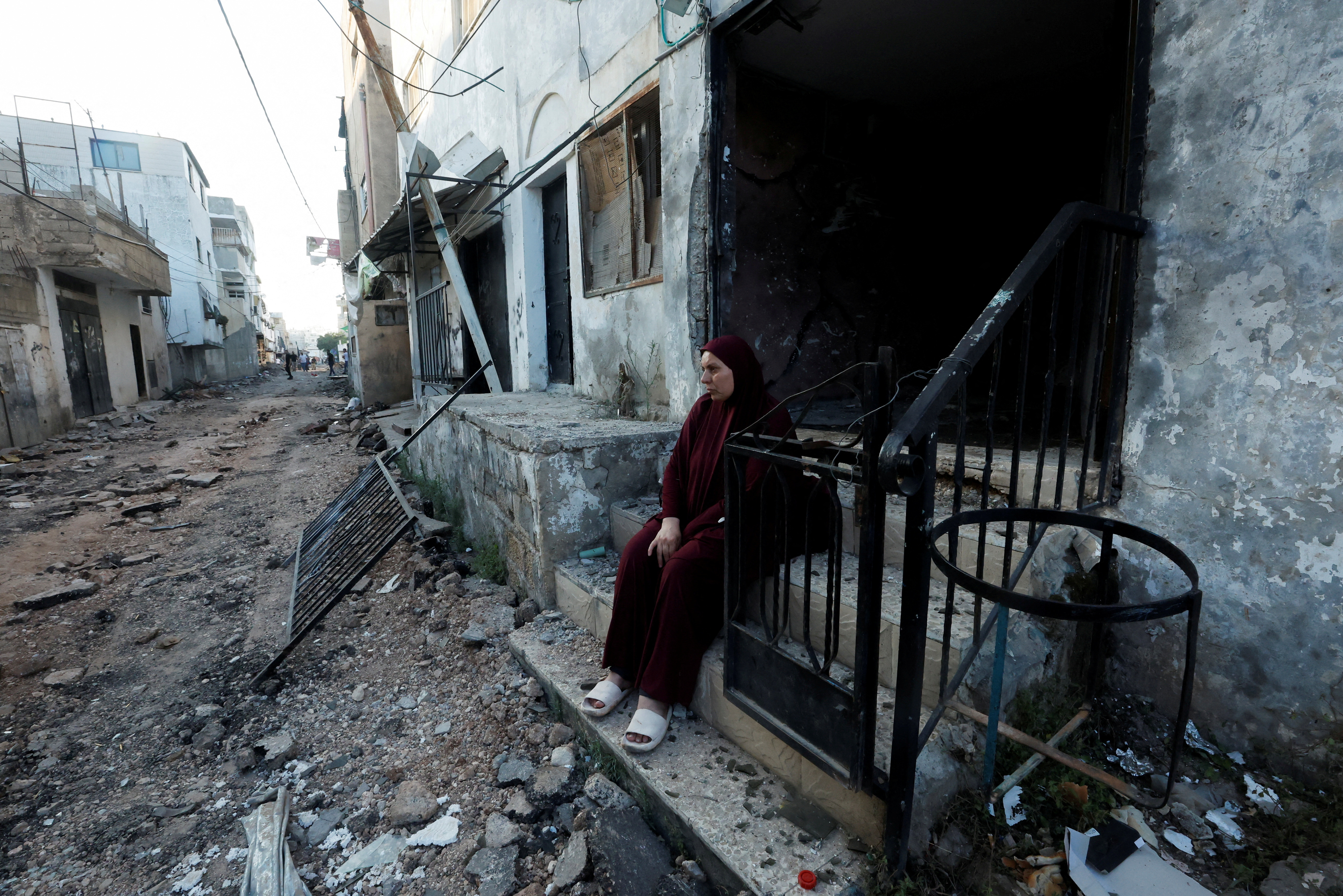 Palestinians inspect damage after the Israeli army's withdrawal from the Jenin camp