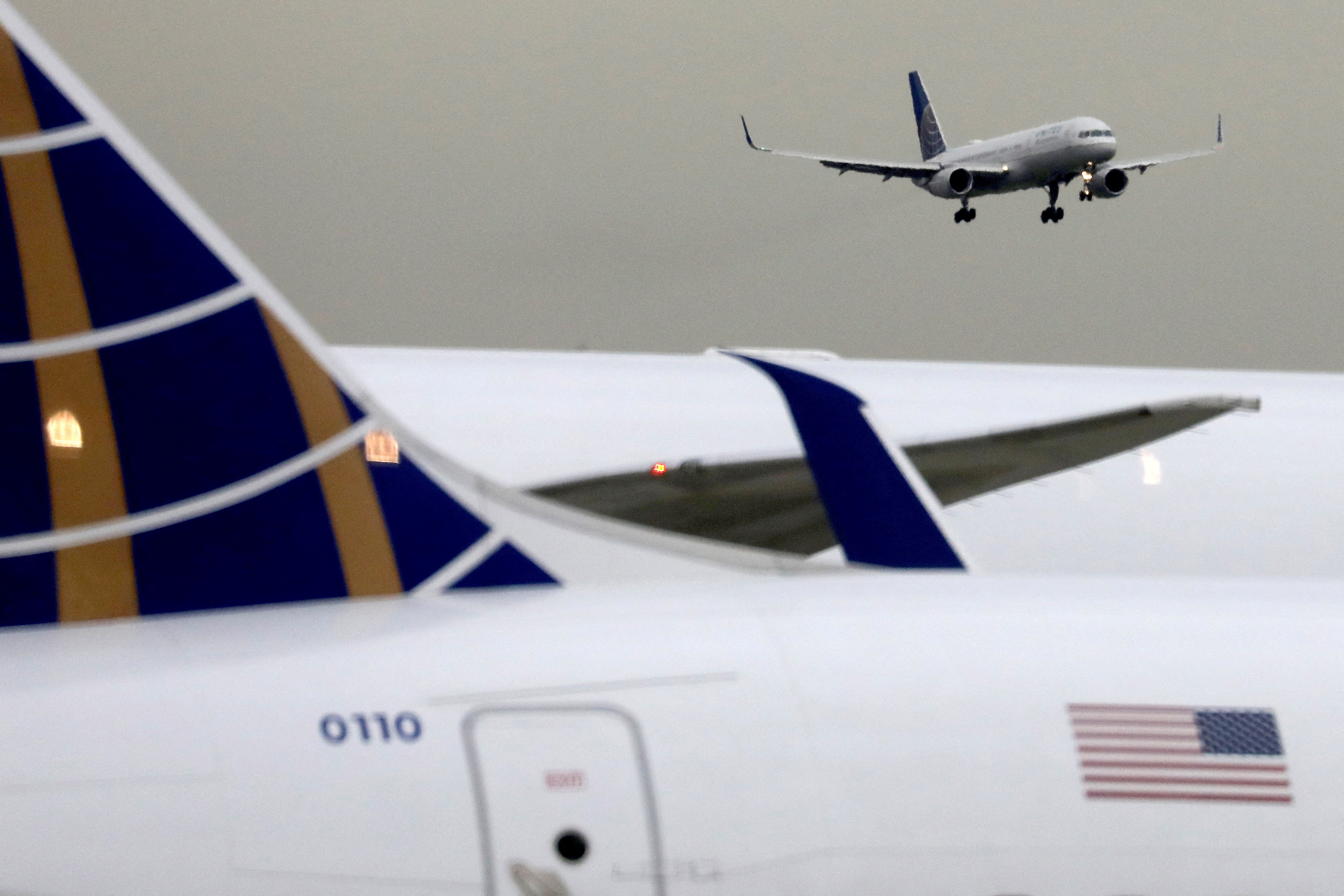 A United Airlines passenger jet lands at Newark Liberty International Airport