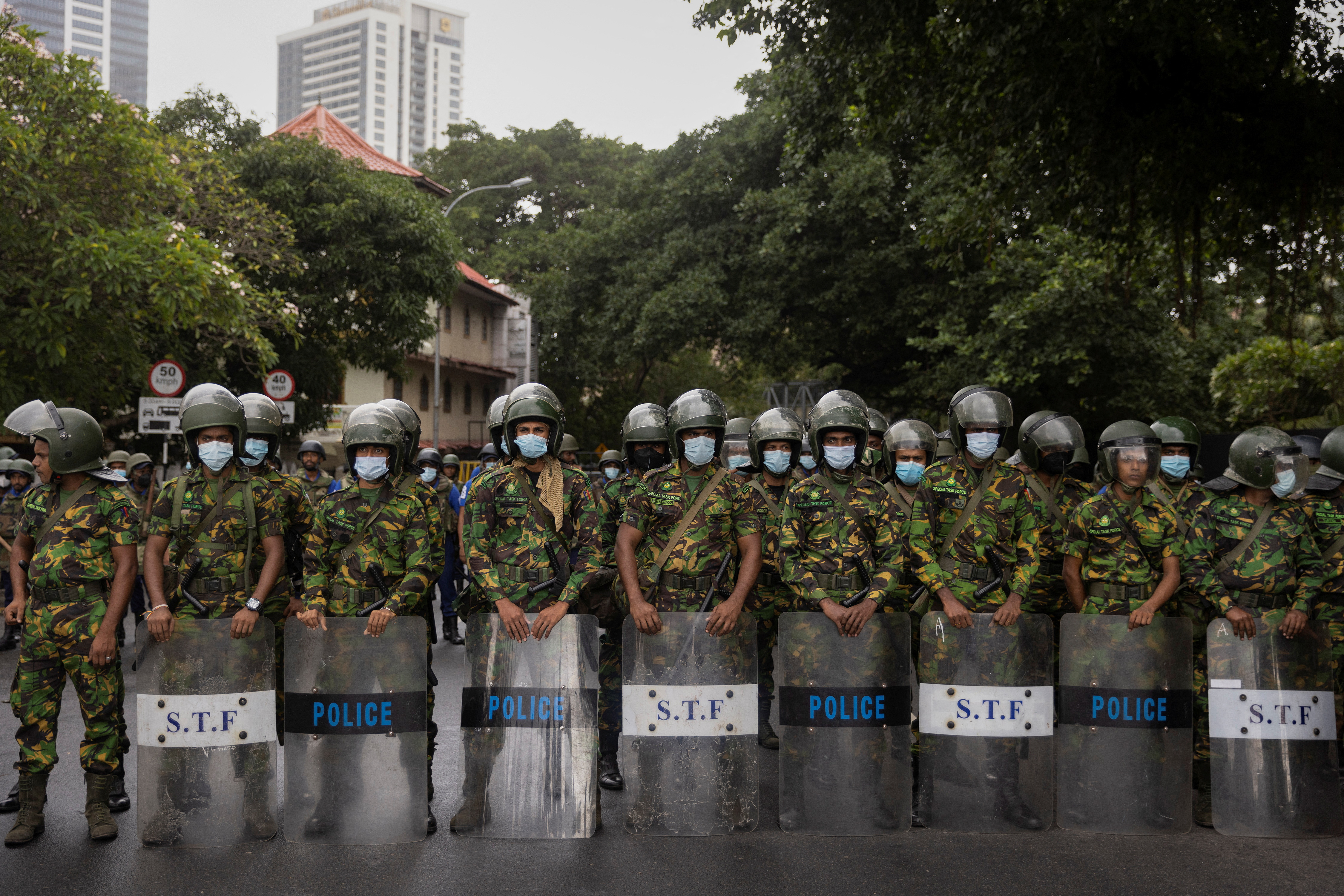 Security personnel stand guard during a protest near the Presidential Secretariat in Colombo