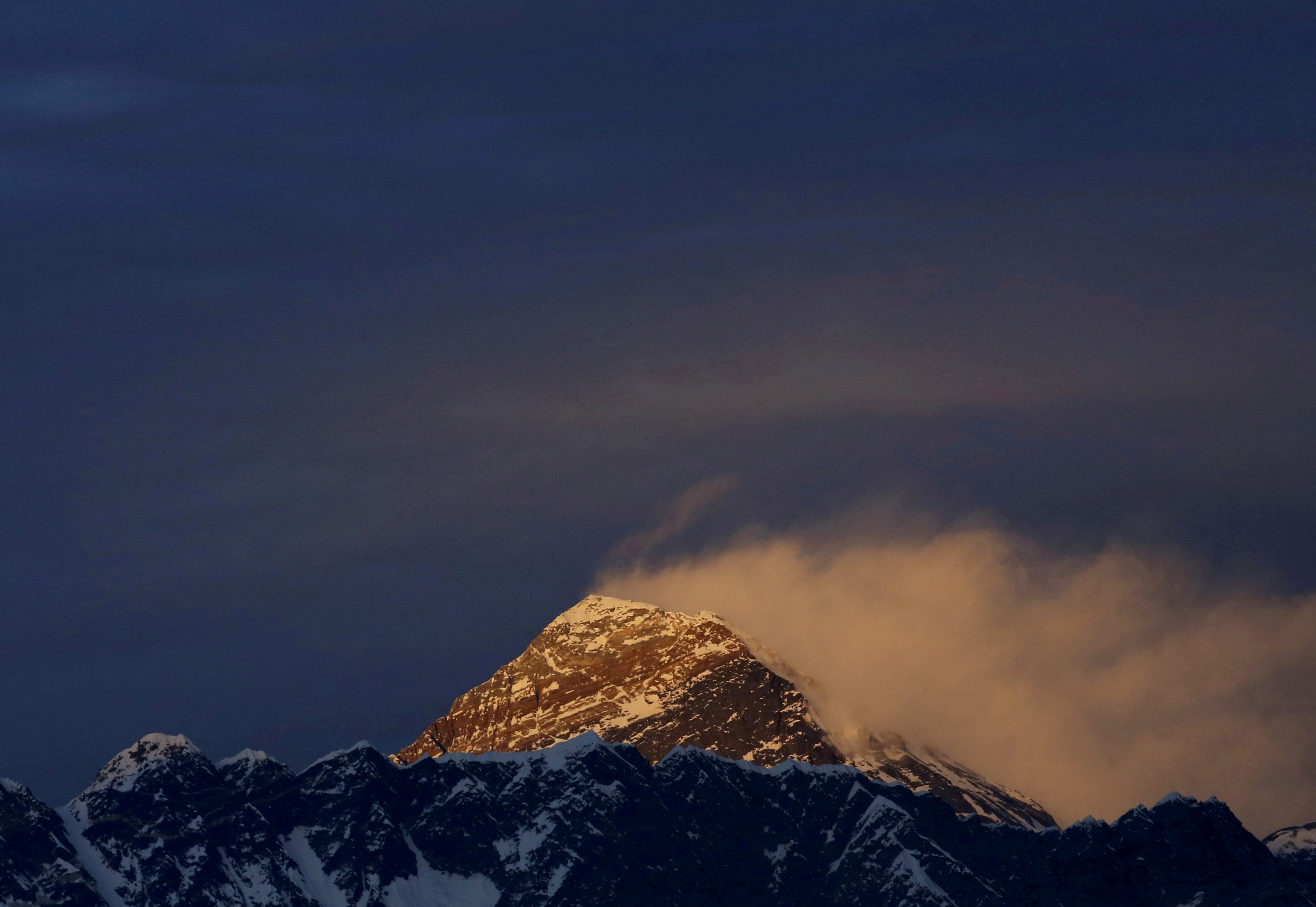 FILE PHOTO: Light illuminates Mount Everest, during sunset in Solukhumbu District also known as the Everest region