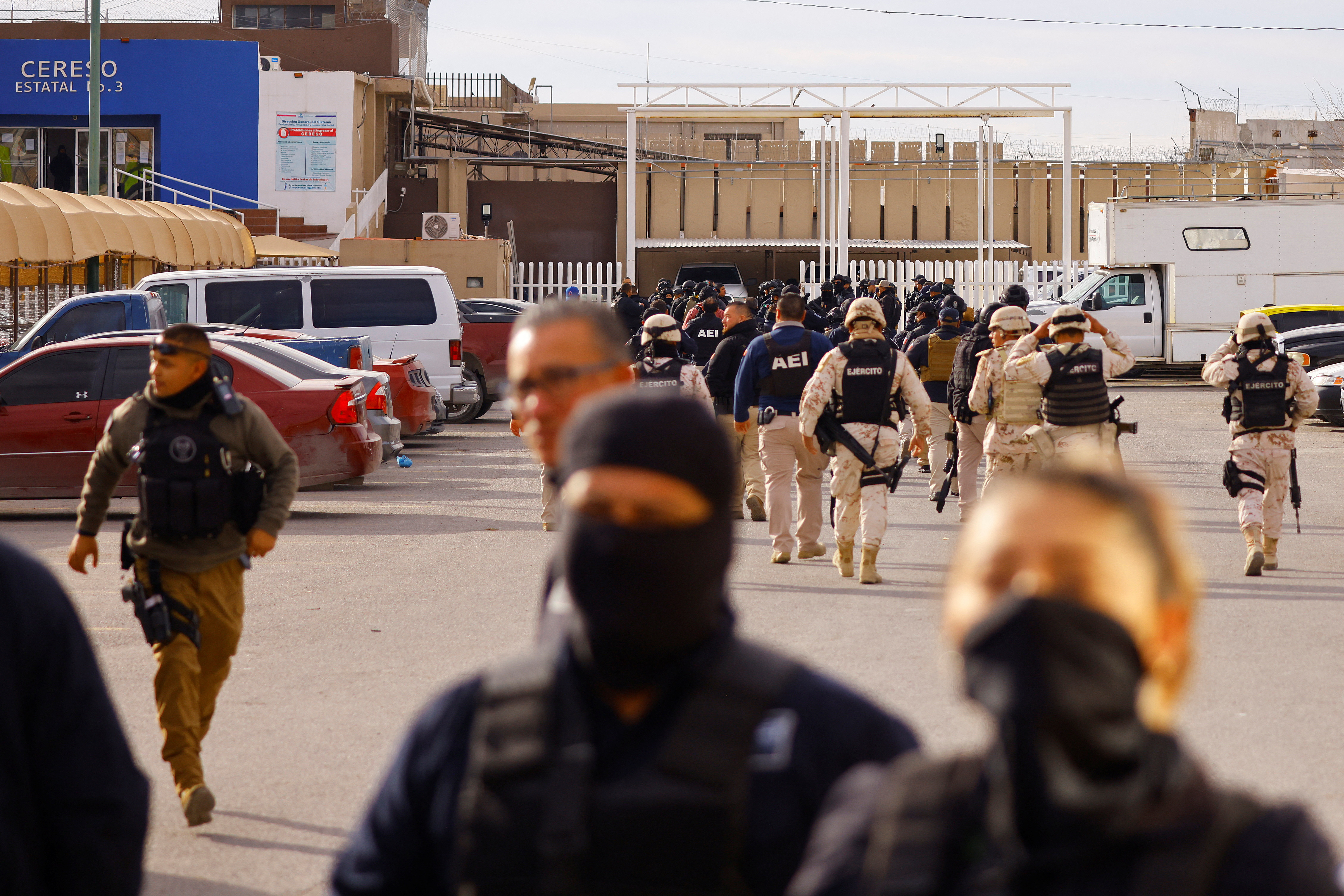 Security forces arrive at Cereso number 3 state prison after unknown assailants entered the prison and freed several inmates, resulting in injuries and deaths, in Ciudad Juarez