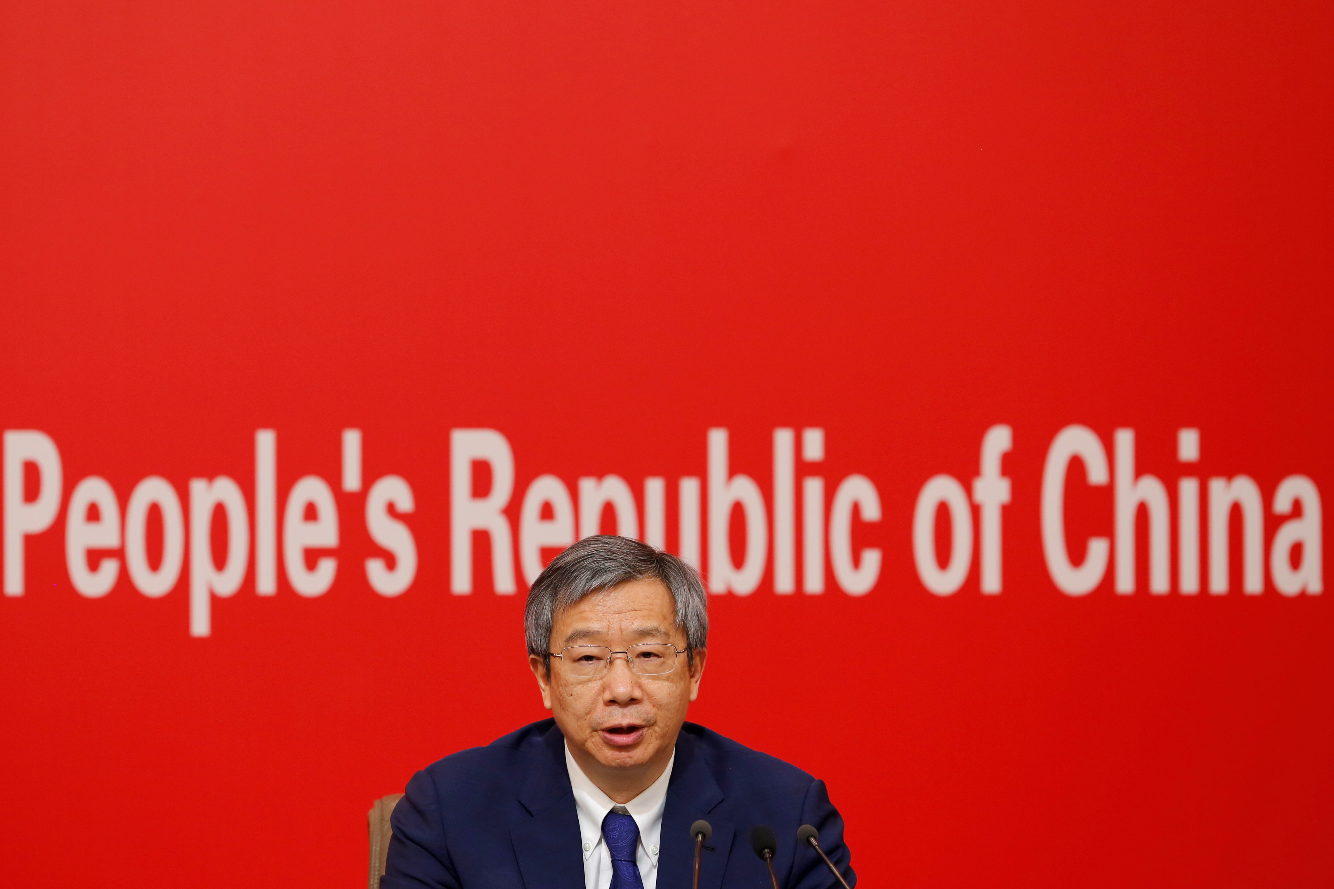 Governor of People's Bank of China (PBOC) Yi Gang attends a news conference on China's economic development ahead of the 70th anniversary of its founding, in Beijing