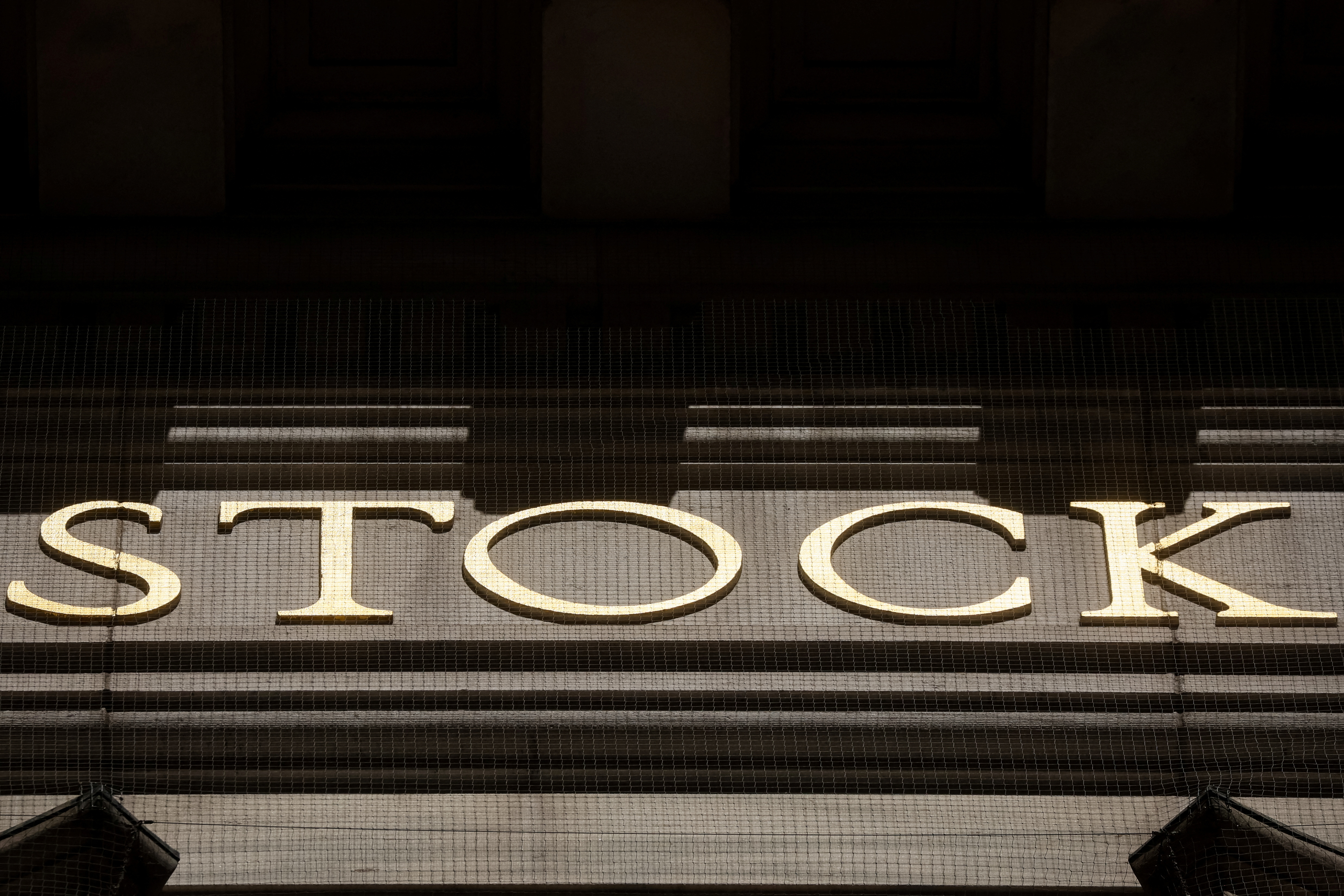 The word Stock is seen on the facade of the NYSE in New York