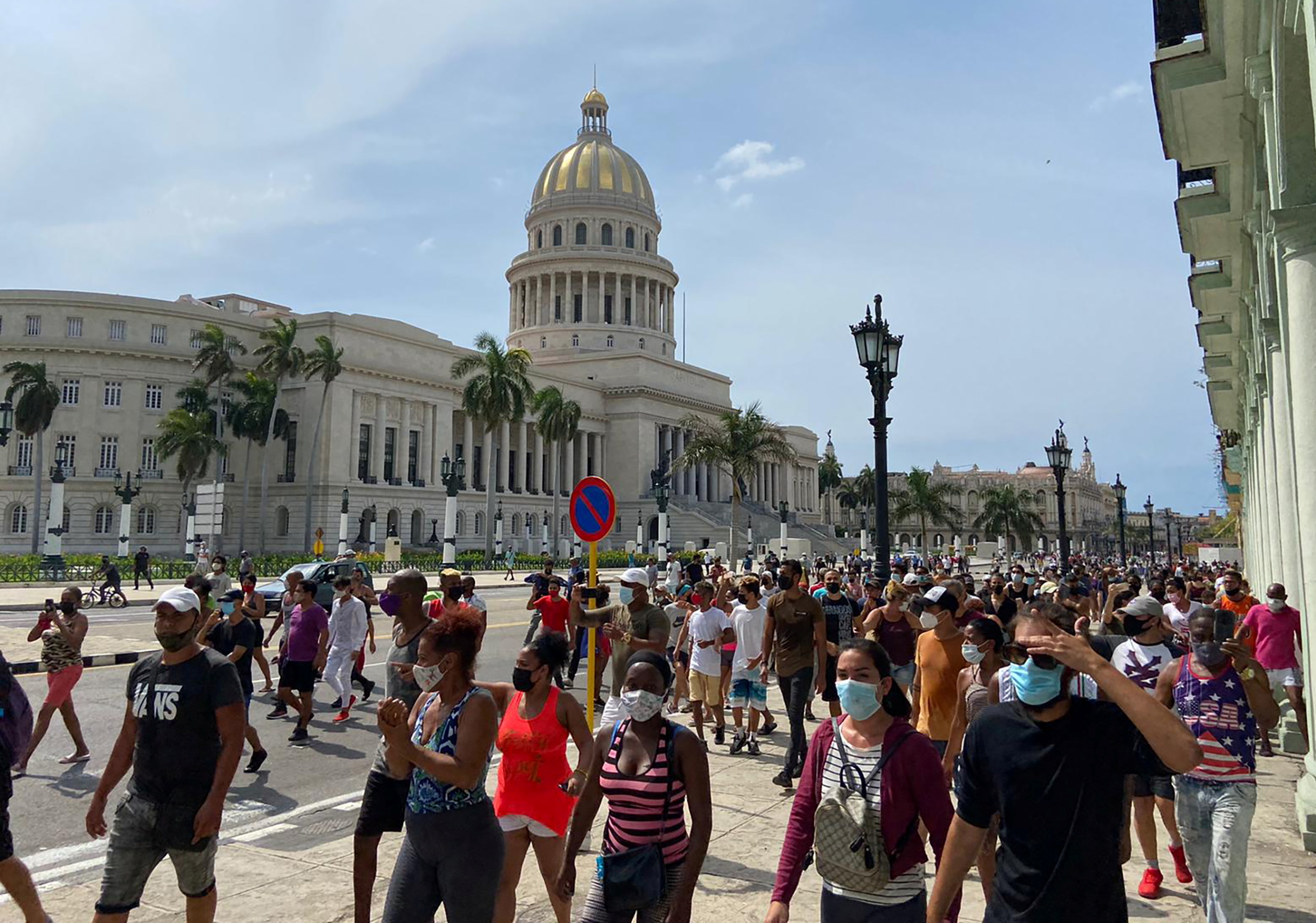 People gather during protests against and in support of the government, in Havana
