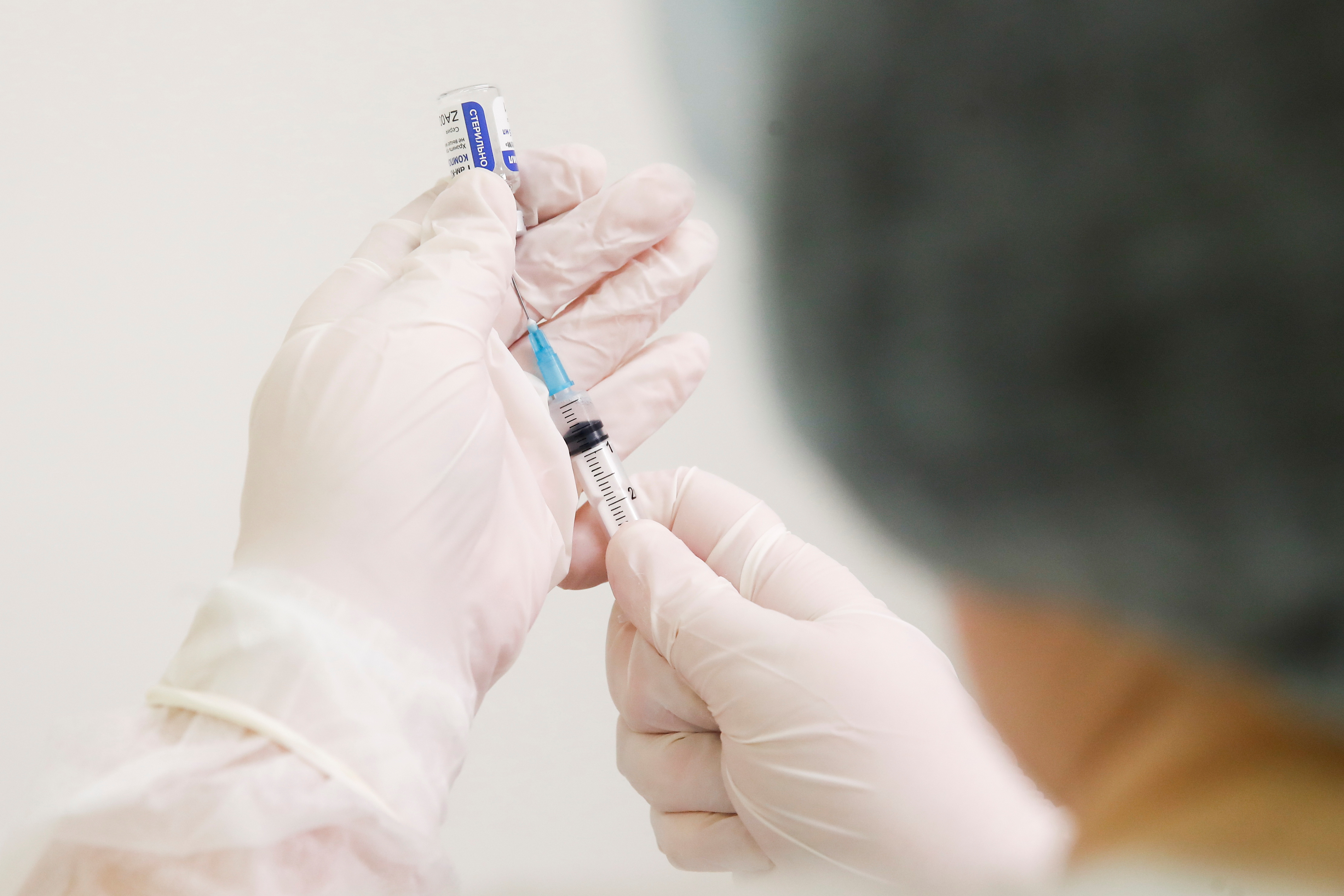 A healthcare worker fills a syringe with a dose of Sputnik V (Gam-COVID-Vac) vaccine against the coronavirus disease (COVID-19) in Moscow