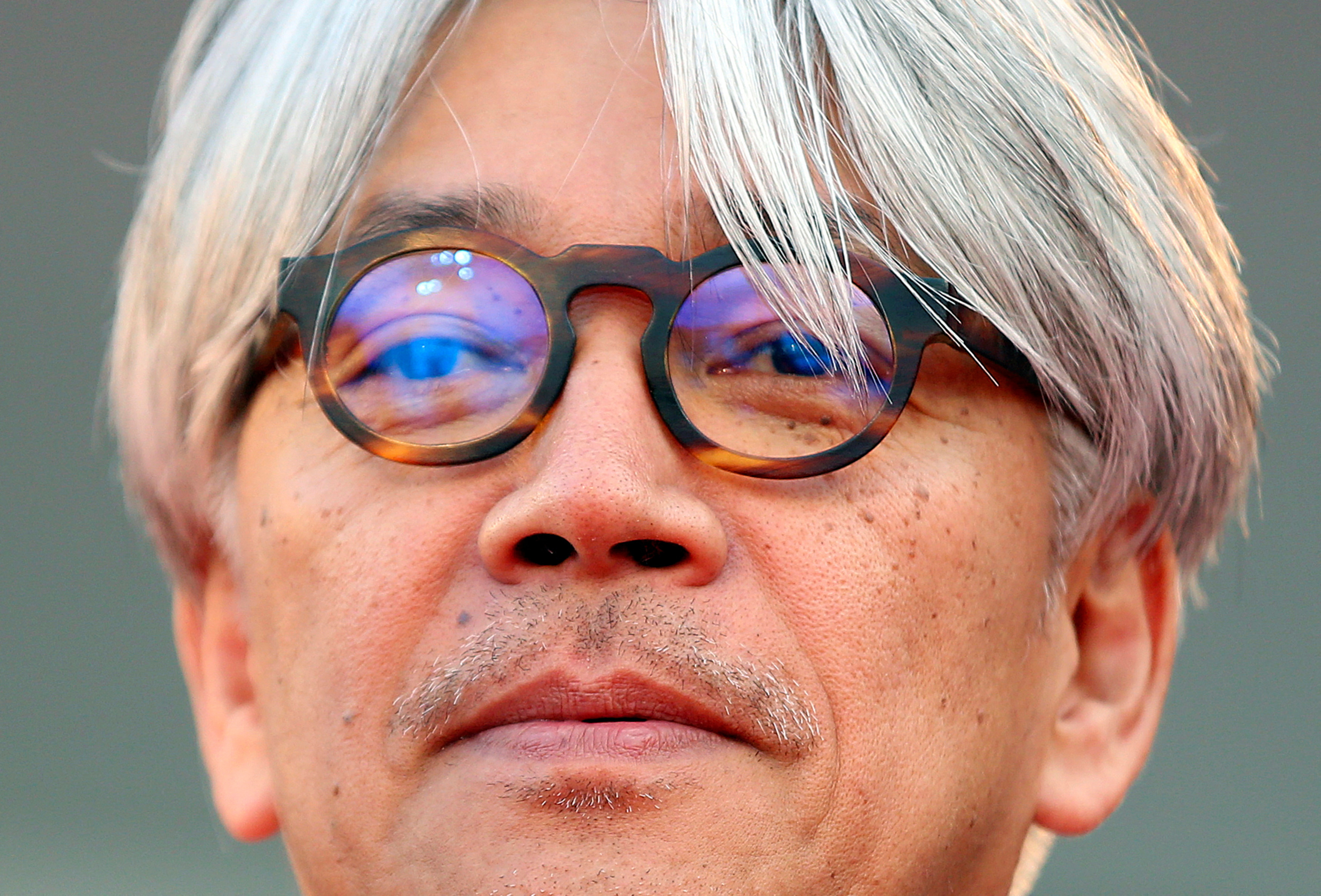 Sakamoto, jury member and Japanese musician, looks on as he arrives on the red carpet for the premiere of 