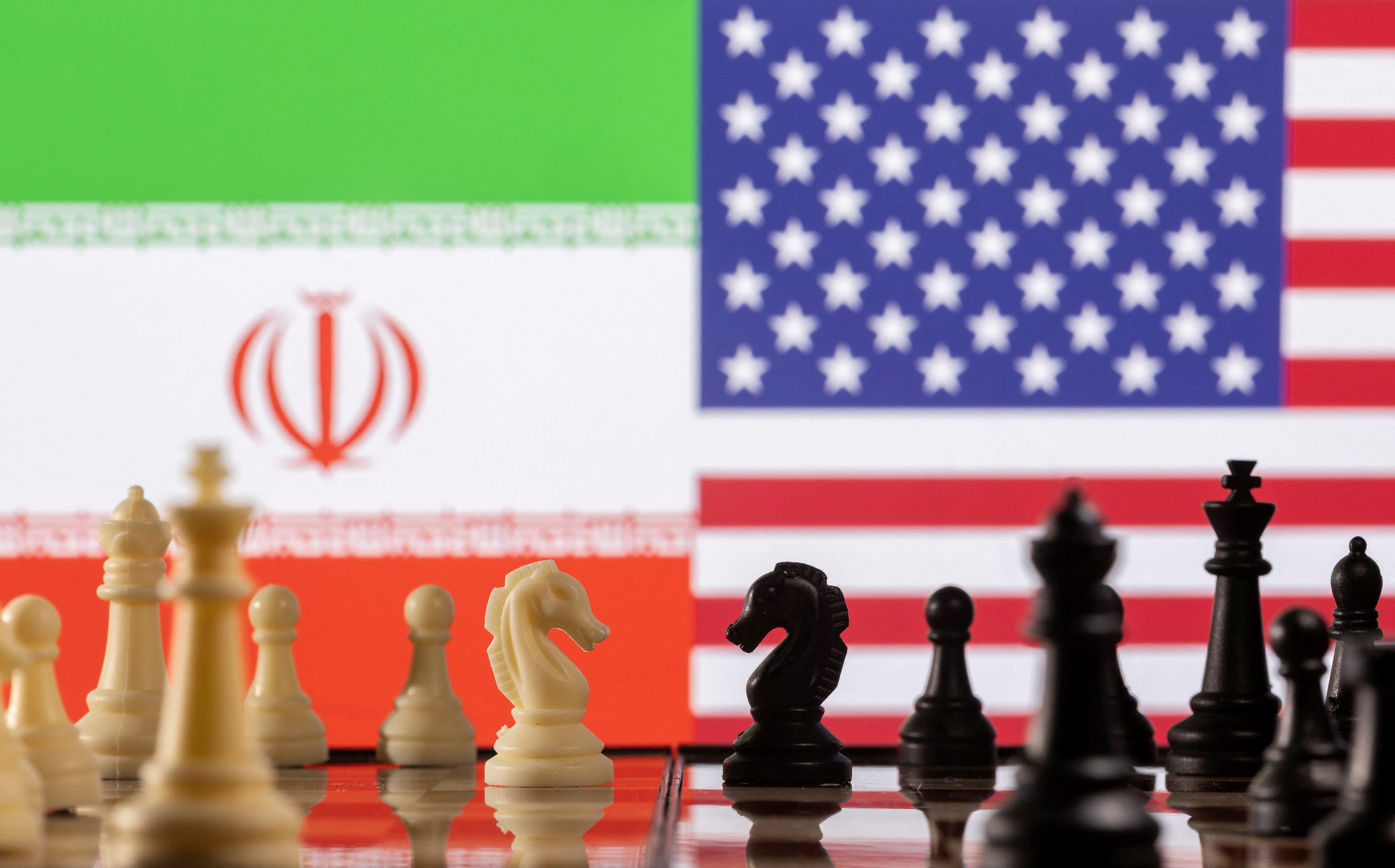 Illustration shows Iran's and U.S. flags