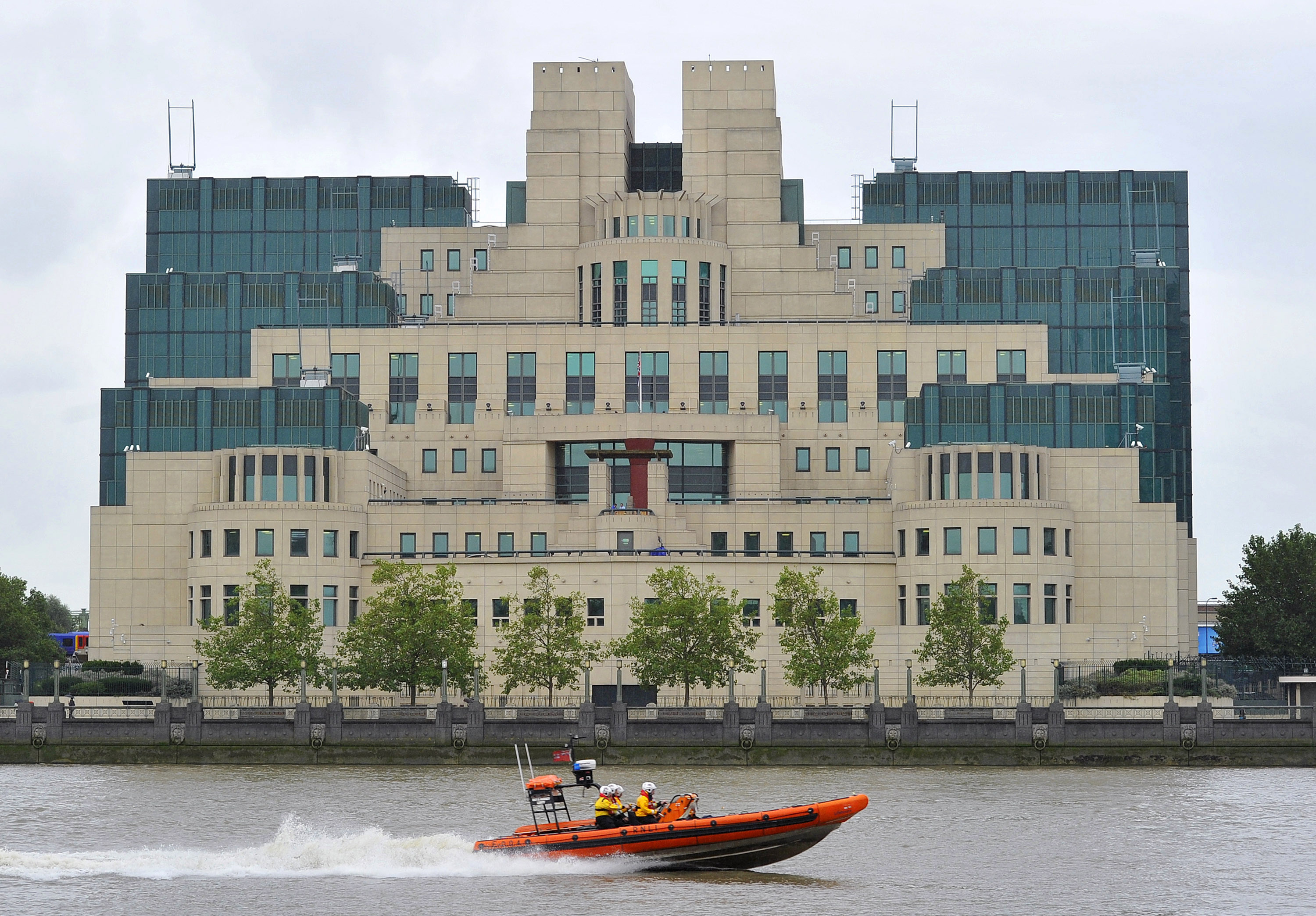 UK's MI6 boss says Putin under pressure, invites Russians to spy for ...