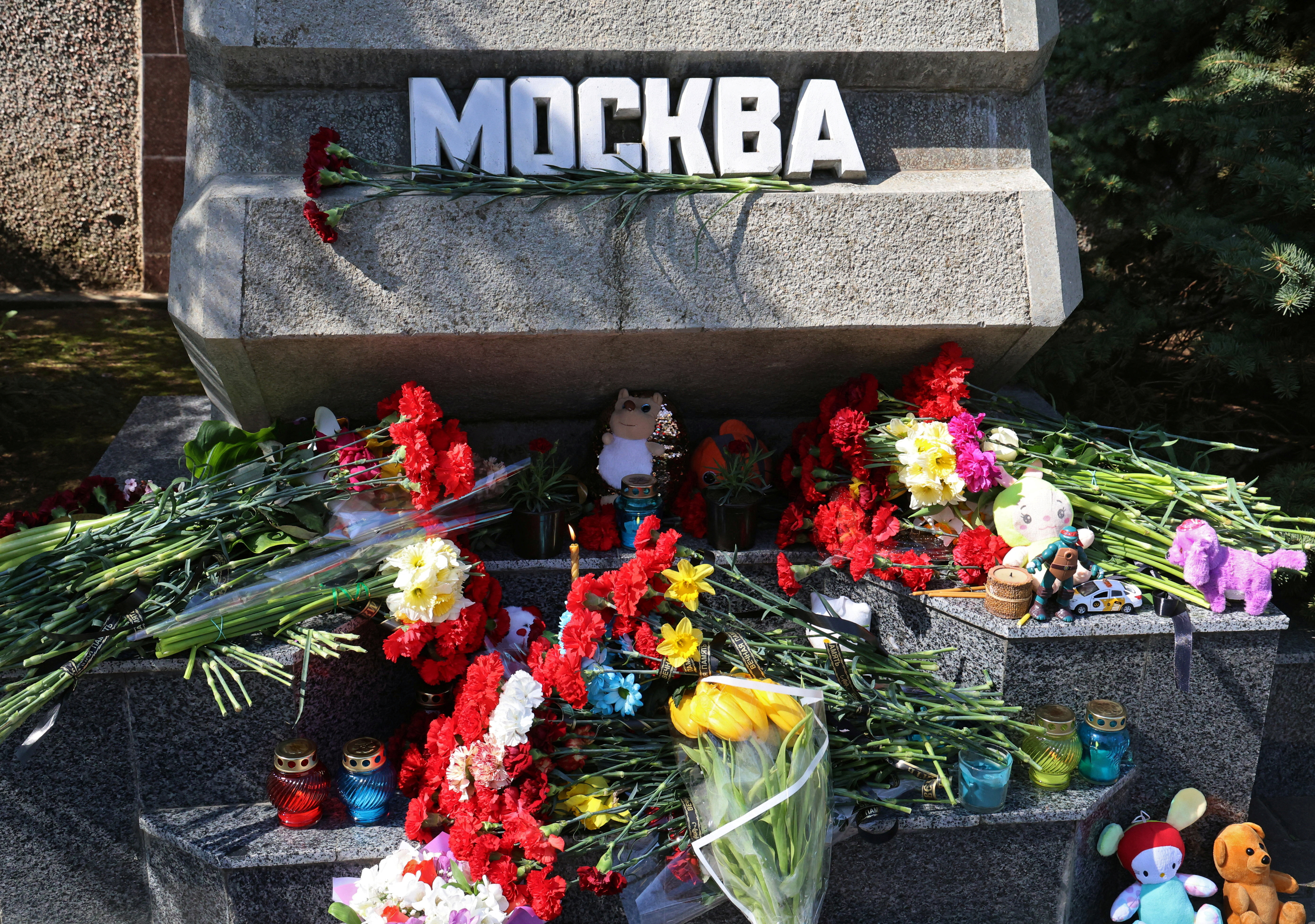 Flowers and toys are placed at the Alley of Hero Cities in memory of the victims of a shooting attack at a concert venue outside Moscow, in Sevastopol