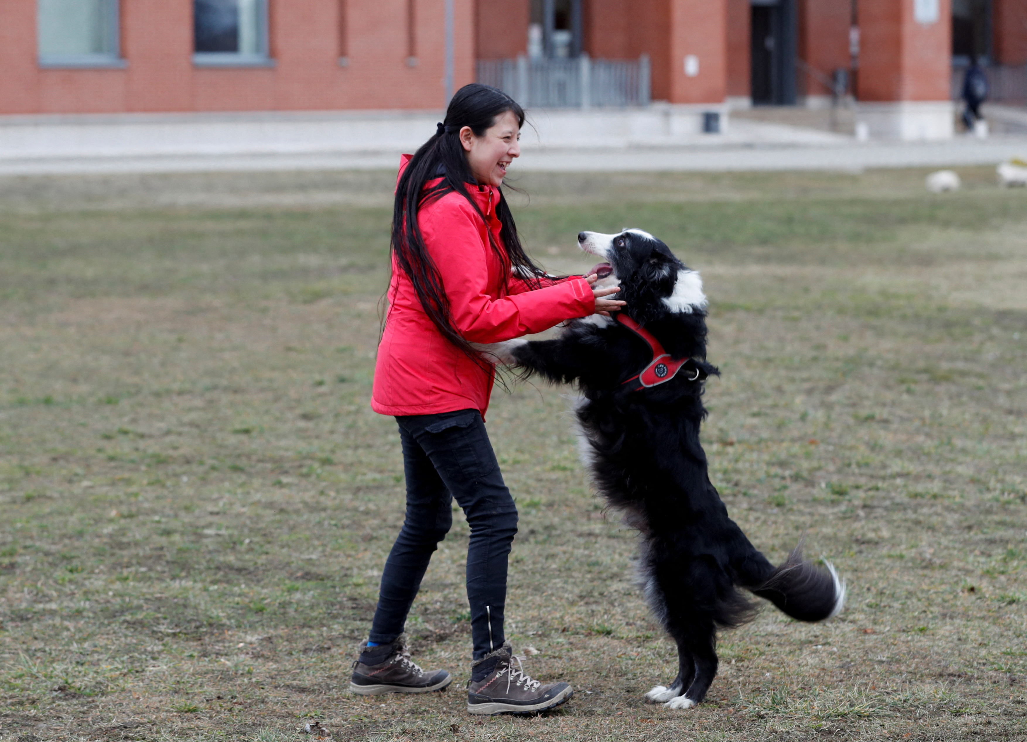 Postdoctoral researcher V. Cuaya plays with her dog Kun-kun at the Ethology Department of the Eotvos Lorand University in Budapest