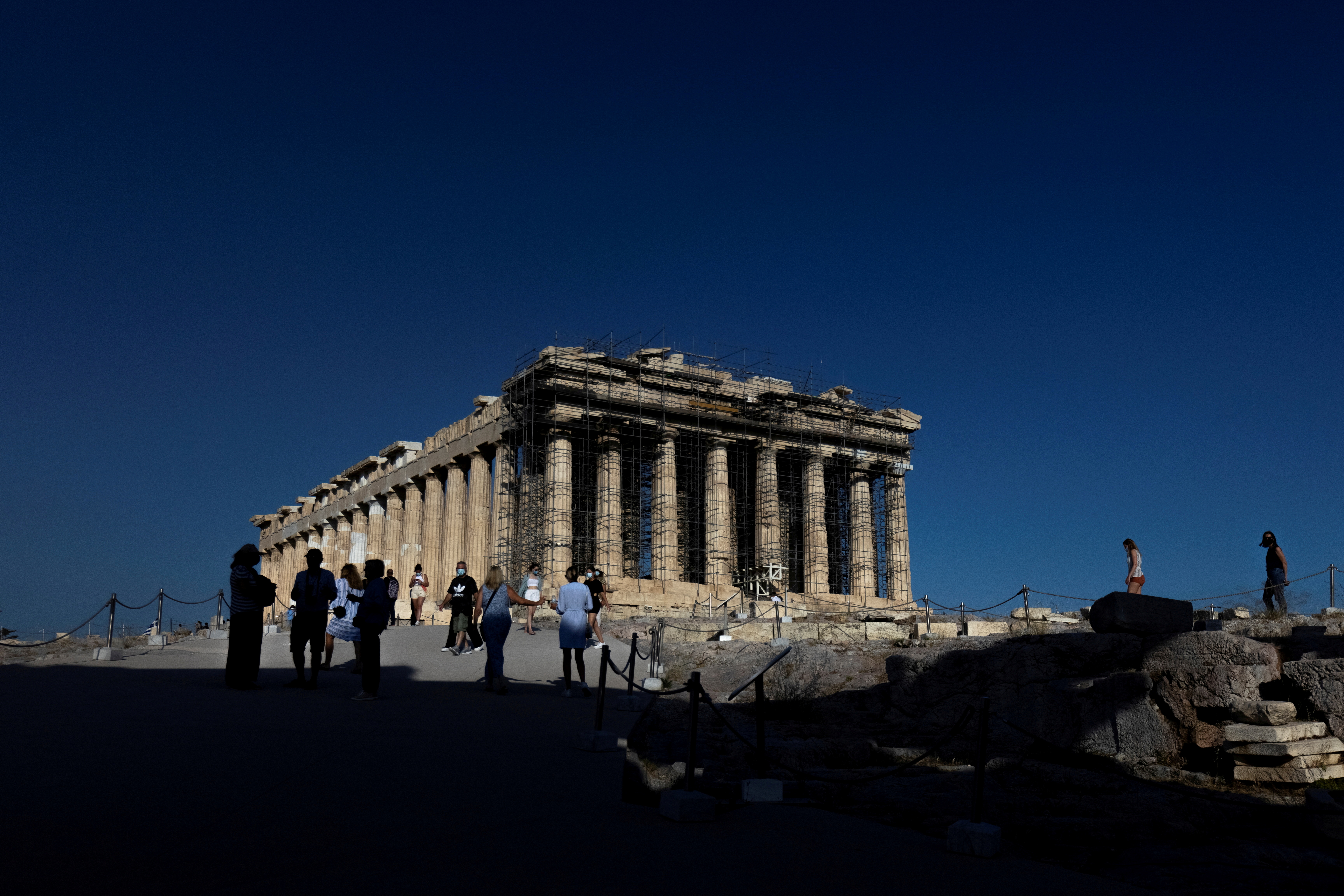 People visit the Parthenon temple atop the Acropolis hill in Athens, Greece, June 8, 2021. Picture taken June 8, 2021. REUTERS/Alkis Konstantinidis/File Photo