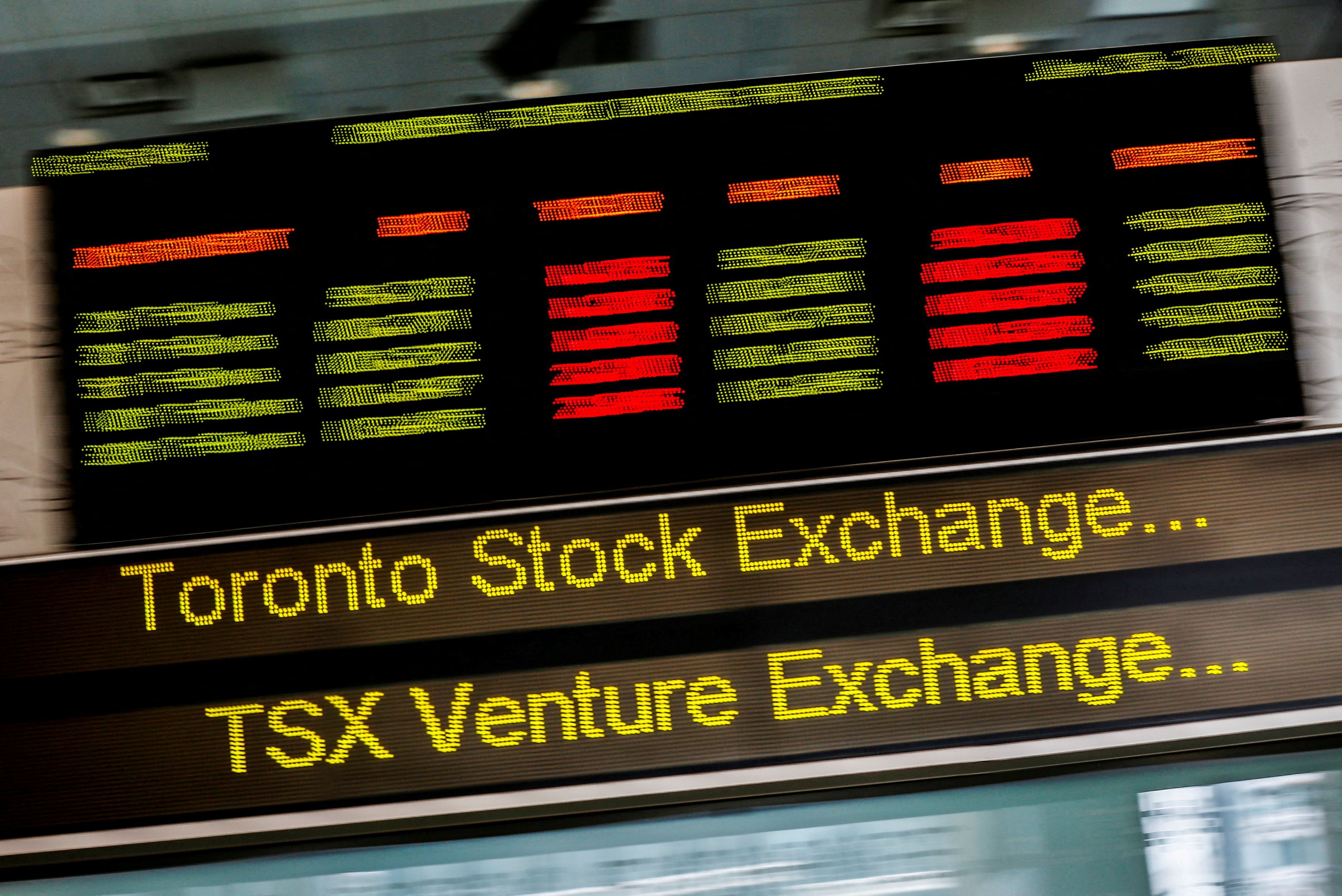 A sign board displaying Toronto Stock Exchange stock information is seen in Toronto