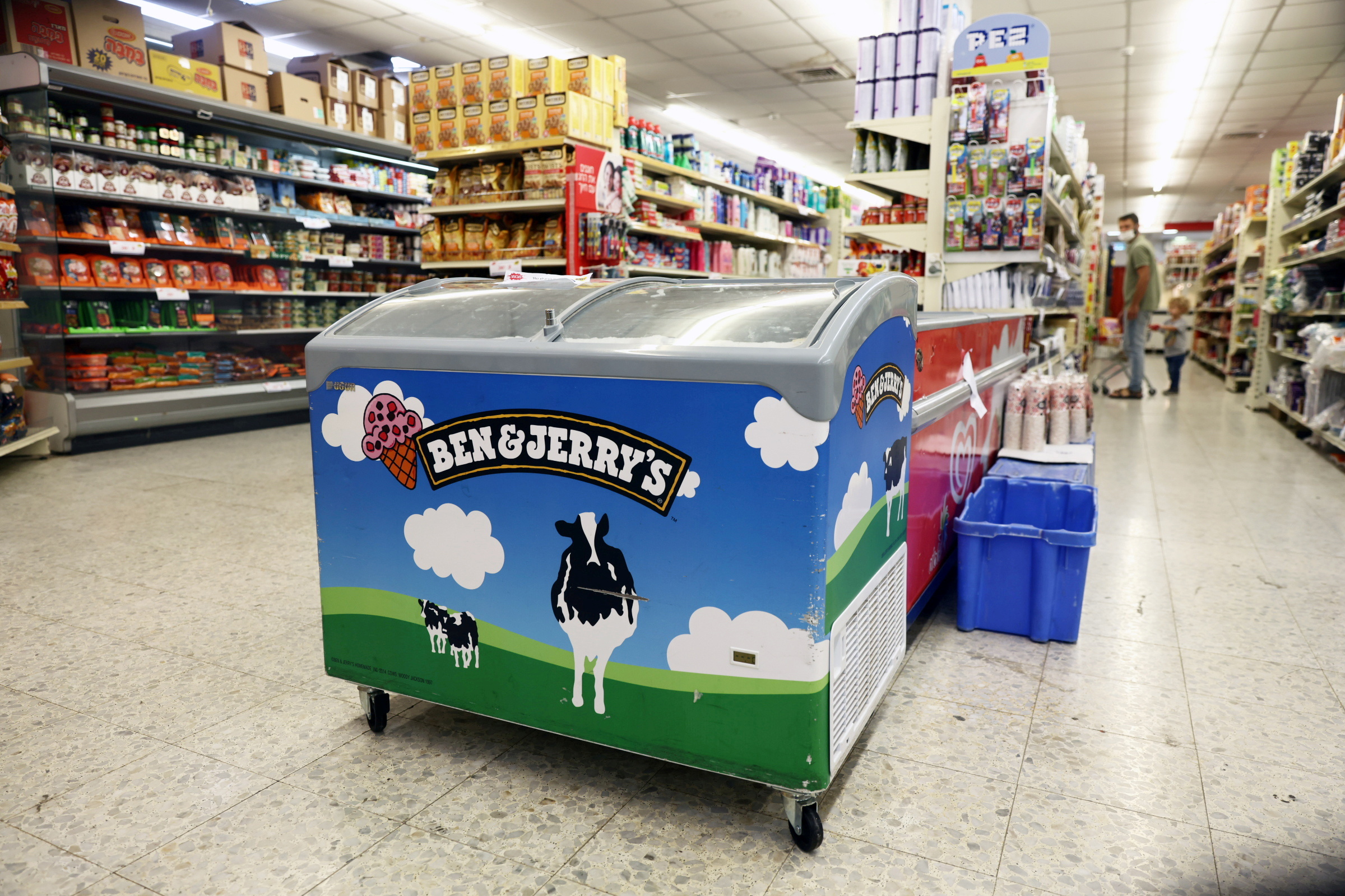 A refrigerator bearing the Ben & Jerry's logo is seen at a food store in the Jewish settlement of Efrat in the Israeli-occupied West Bank July 20, 2021. REUTERS/Ronen Zvulun