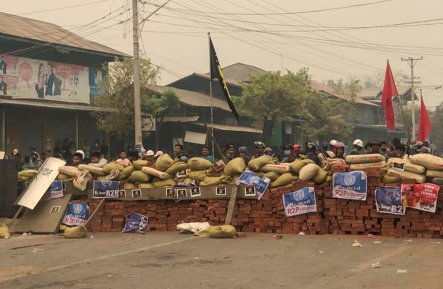Protesters defend themselves from the troops in Kale, Sagaing region