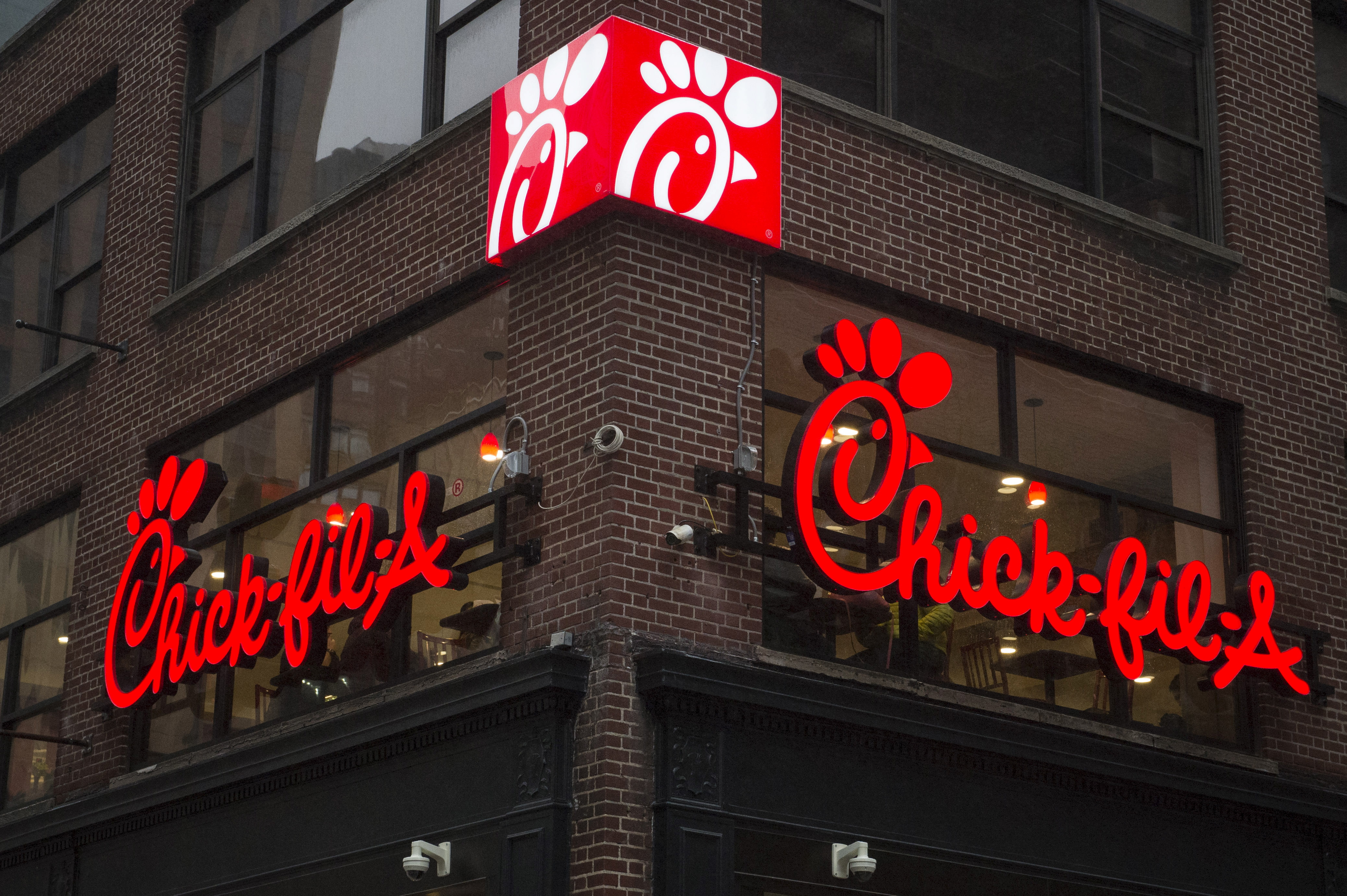 A franchise sign is seen above a Chick-fil-A freestanding restaurant after its grand opening in Midtown, New York