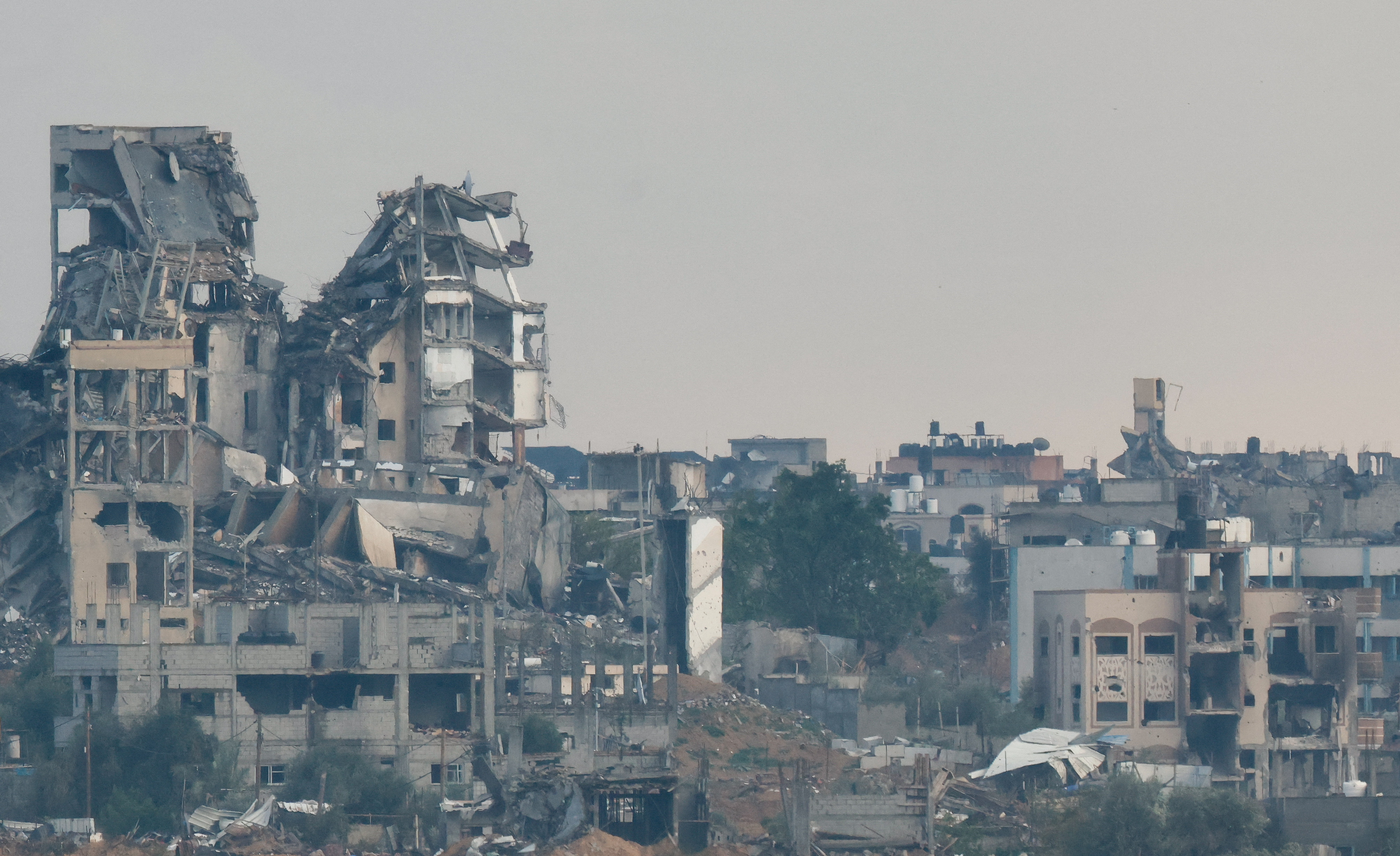 Destroyed buildings lie in ruin in the Gaza Strip, as seen from Israel