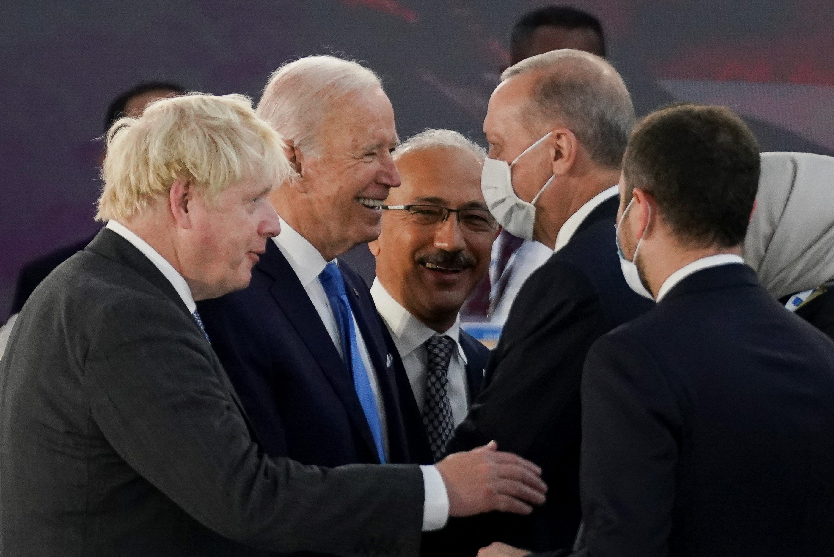 U.S. President Joe Biden talks with Turkey's President Tayyip Erdogan and Britain's Prime Minister Boris Johnson as he attends the G20 leaders' summit in Rome, Italy October 30, 2021. REUTERS/Kevin Lamarque/Pool