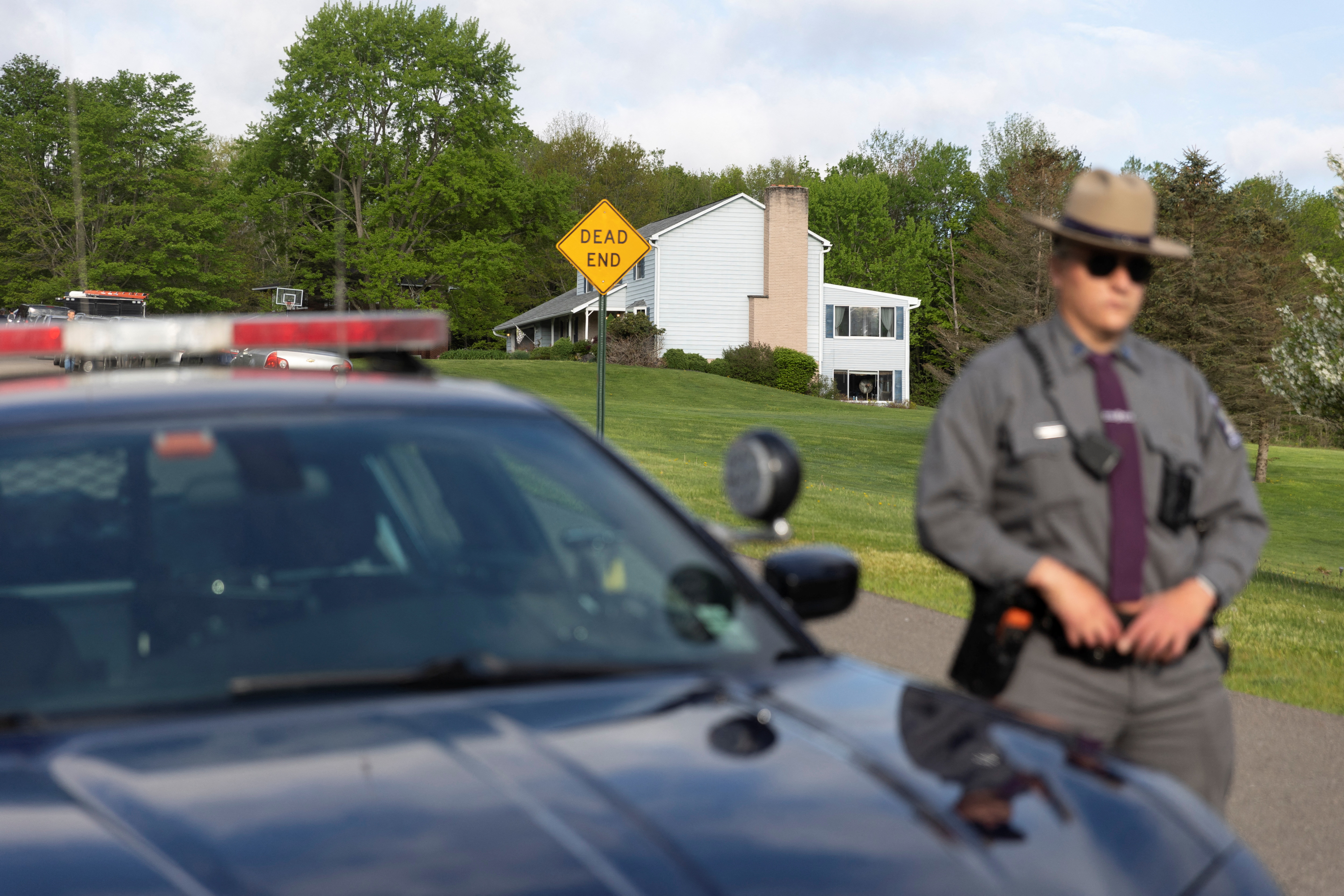 Law enforcement personnel are seen at the home of Buffalo supermarket shooting suspect