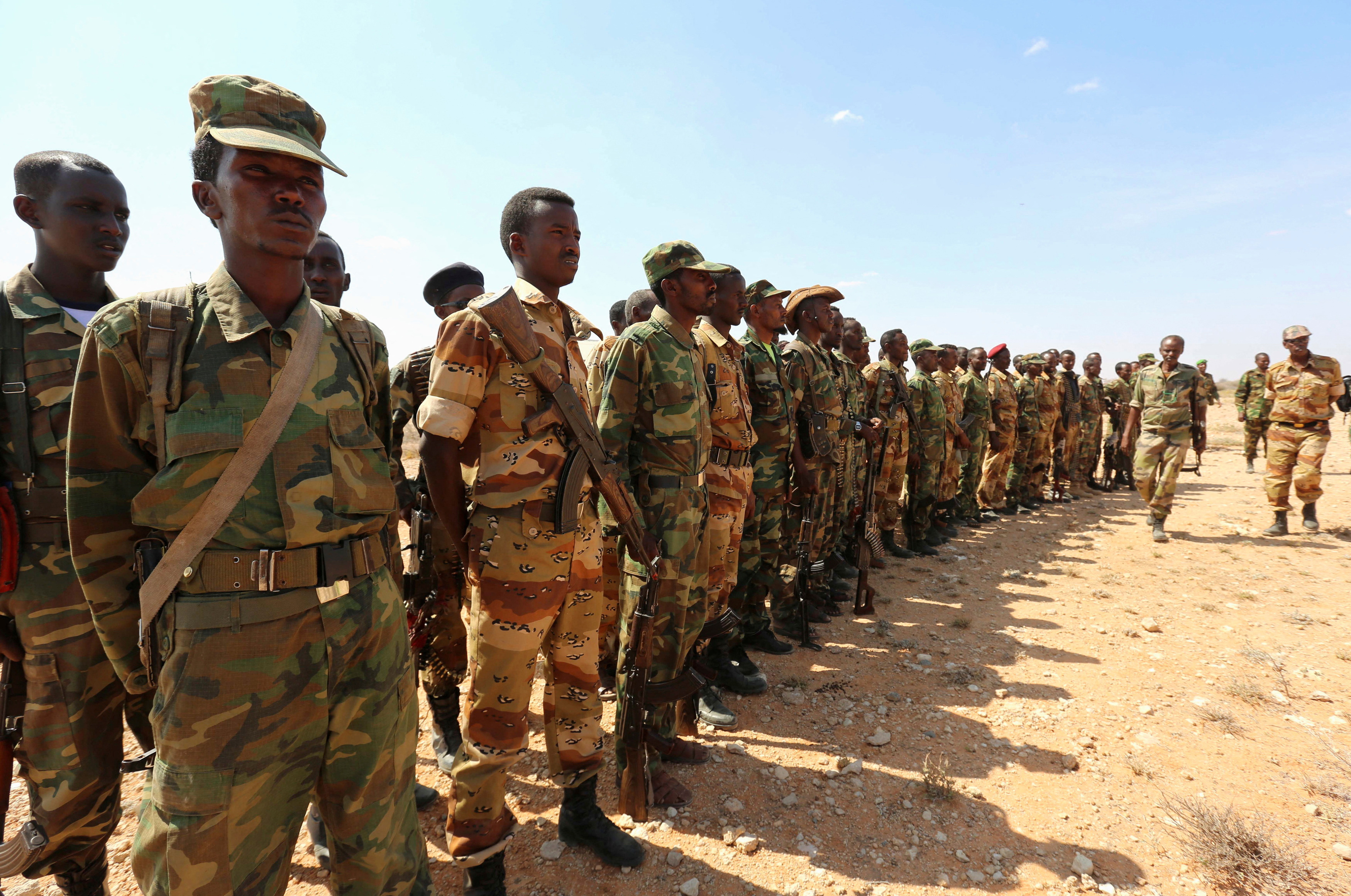 Ethiopian and Somali government soldiers line-up before embarking on a joint patrol in areas south east of Dusamareeb