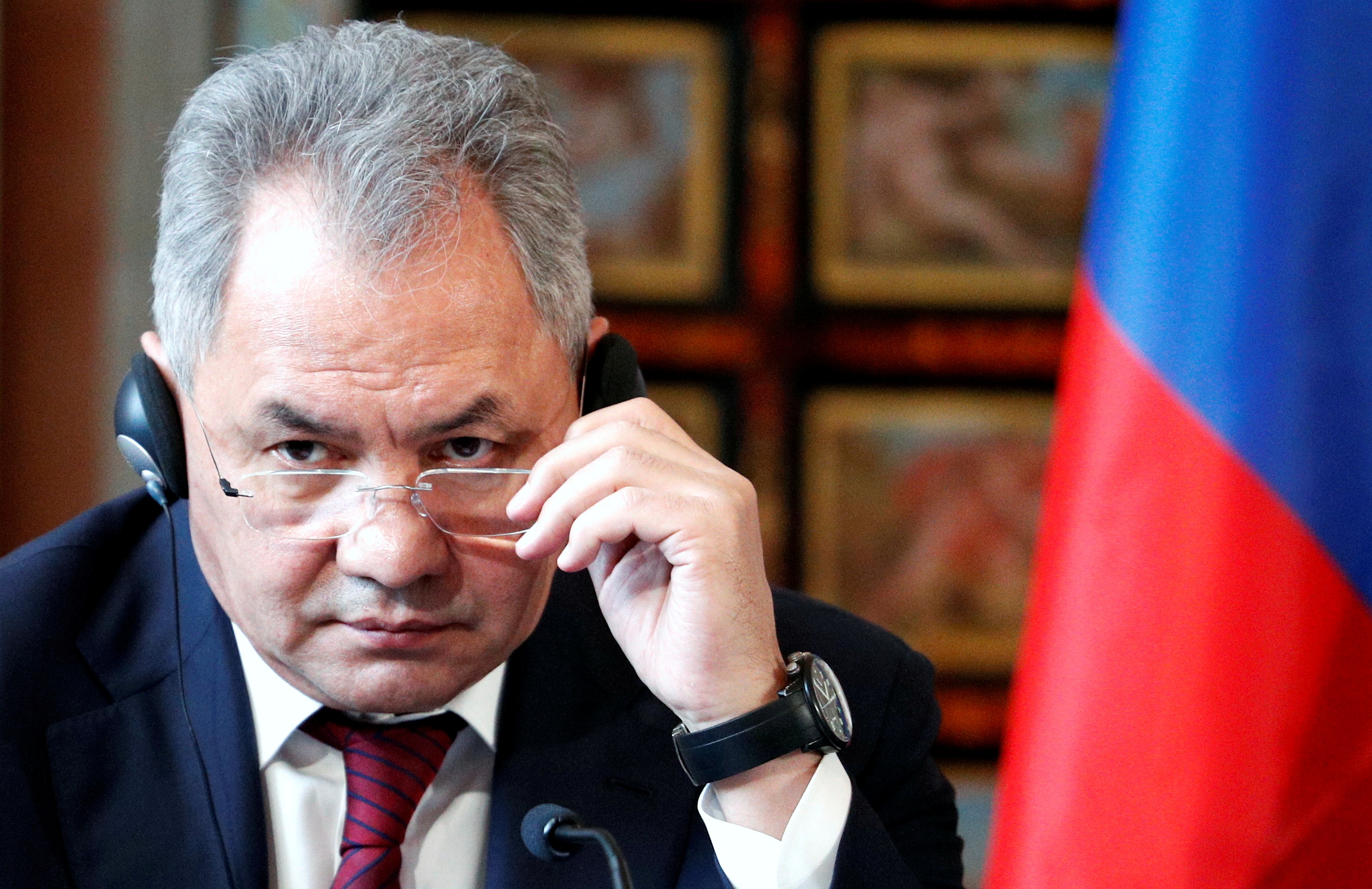 Russian Defence Minister Sergei Shoigu gestures during a news conference after talks between Italy and Russia in Rome