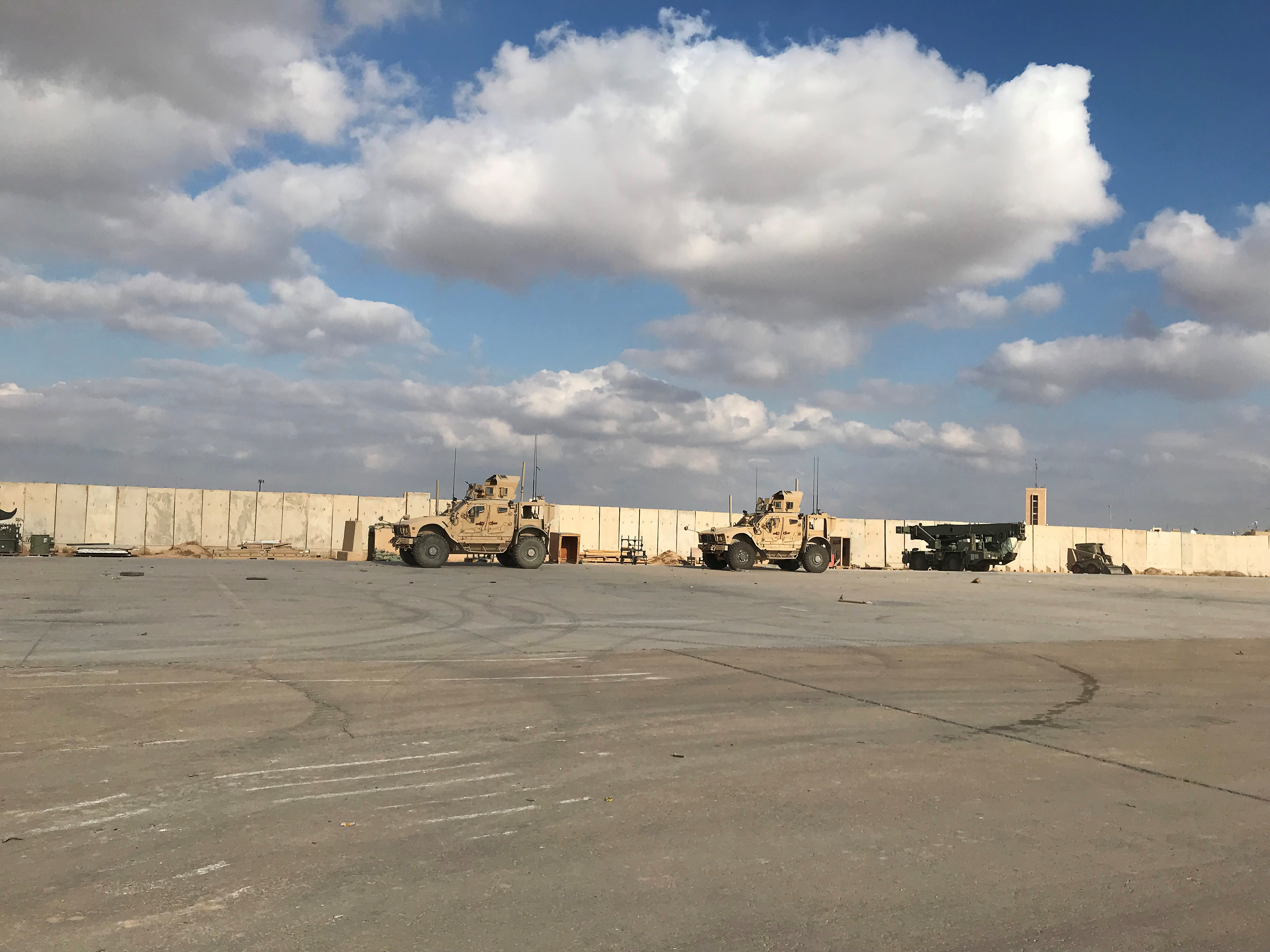 Military vehicles of U.S. soldiers are seen at Ain al-Asad air base in Anbar province