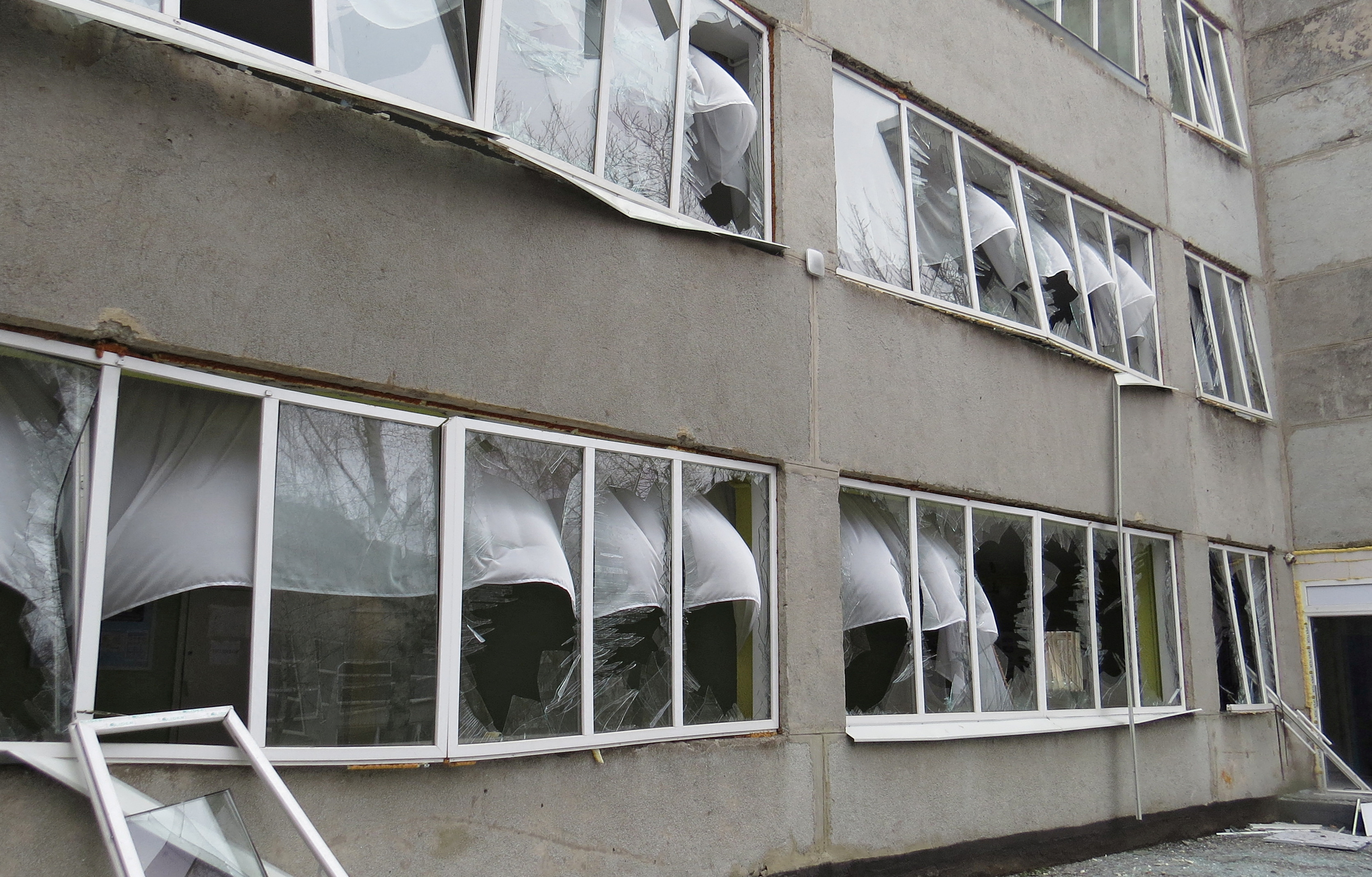 A view shows a damaged school building in Mariupol