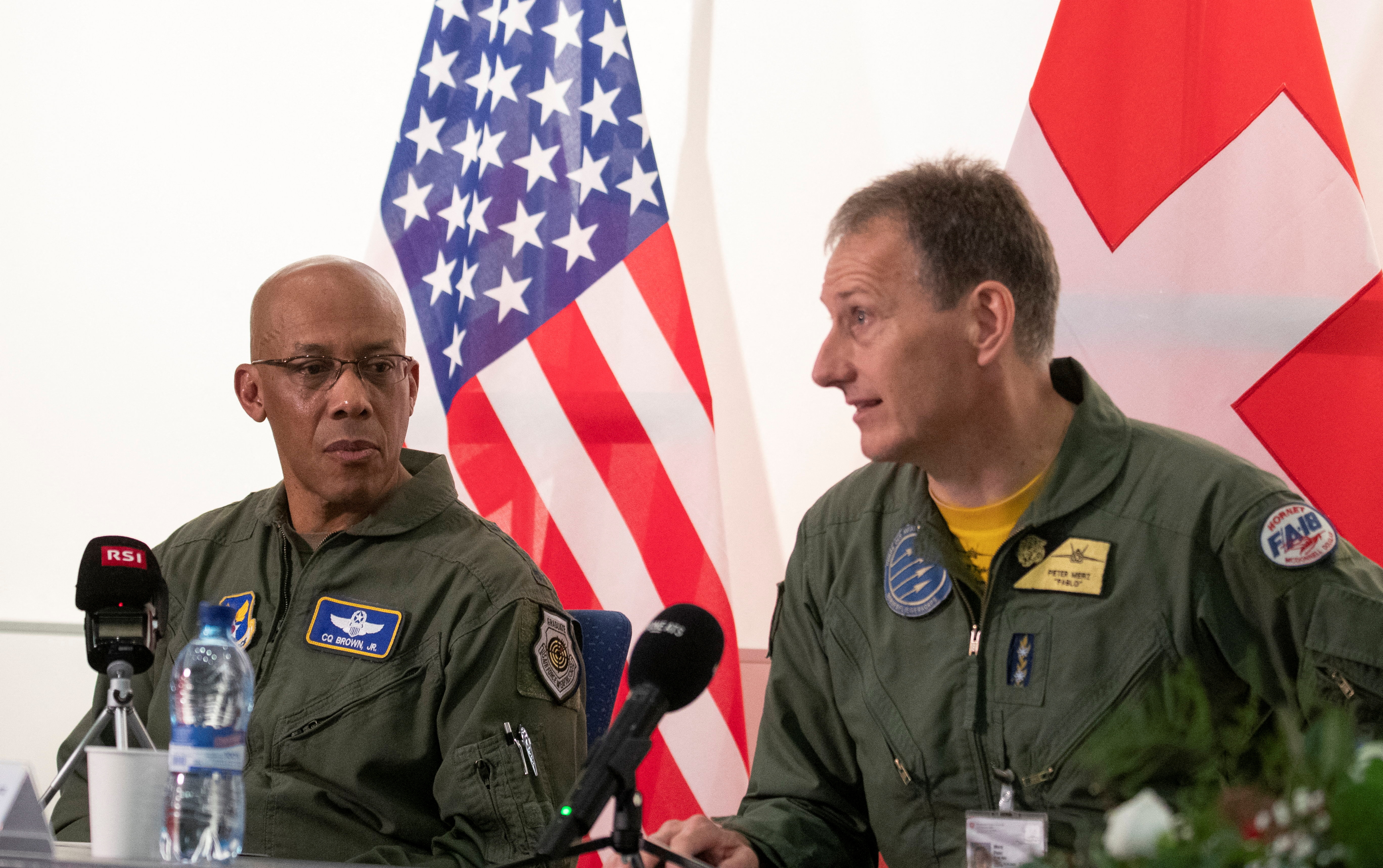 Chief of Staff of the U.S. Air Force General Brown Jr. listens to Commander of the Swiss Air Force General Merz during a news conference in Payerne