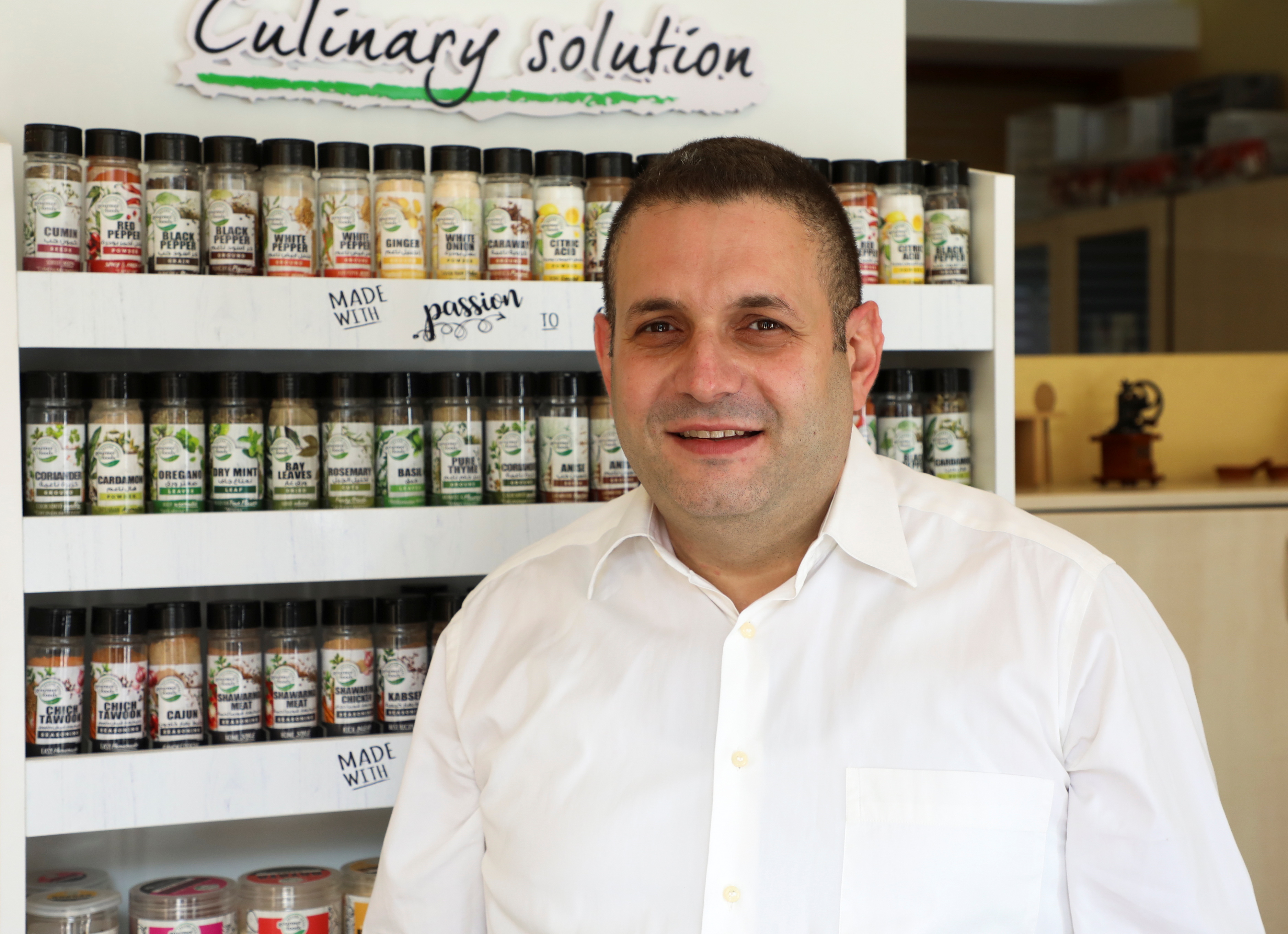 Joe Rizk, a businessman and supply chain manager at Second House Products that makes spice blends and a variety of dry foods, poses for a picture in Mazraat Yachouh
