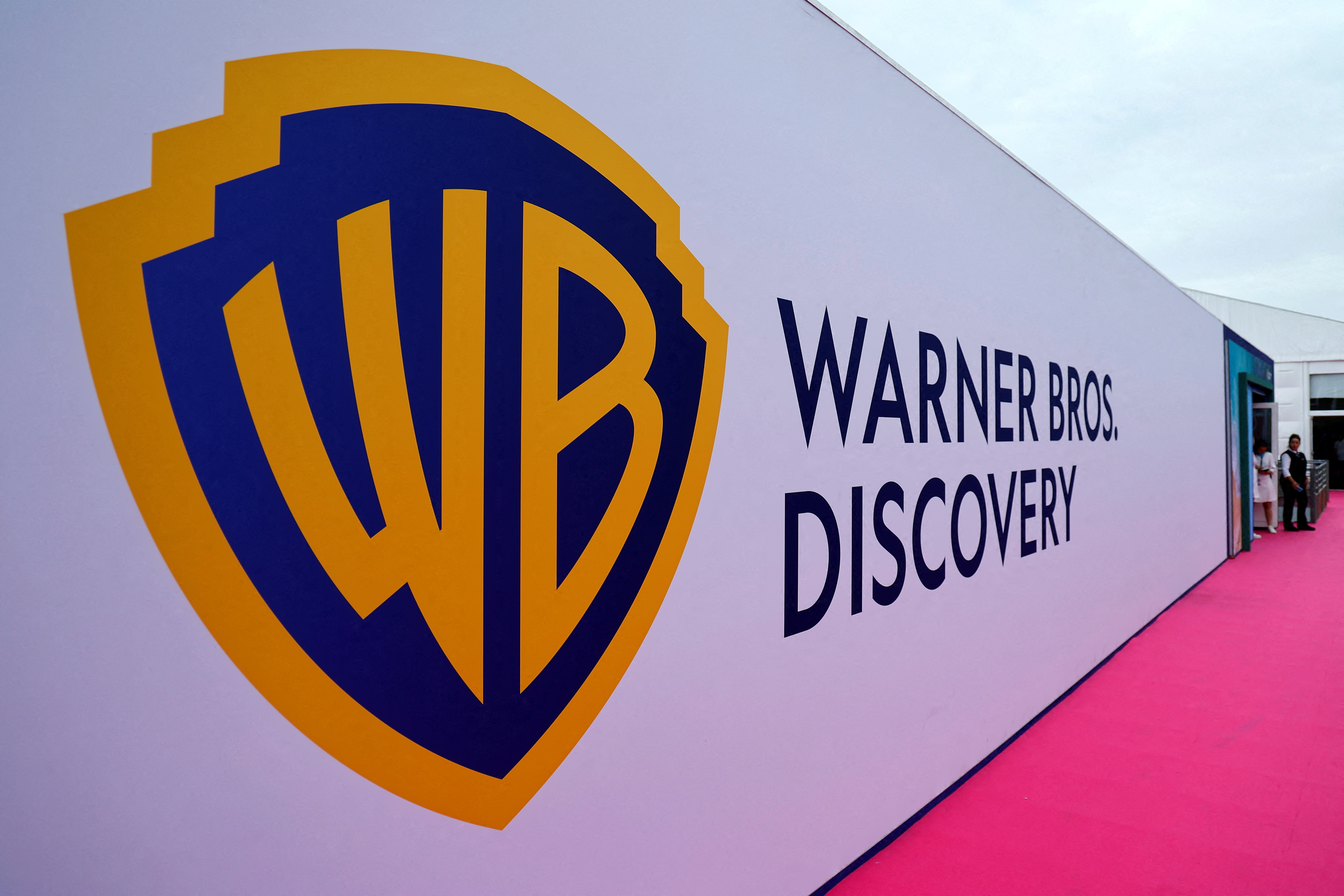 Warner Bros Discovery to tap popular movie franchises, posts loss | Reuters