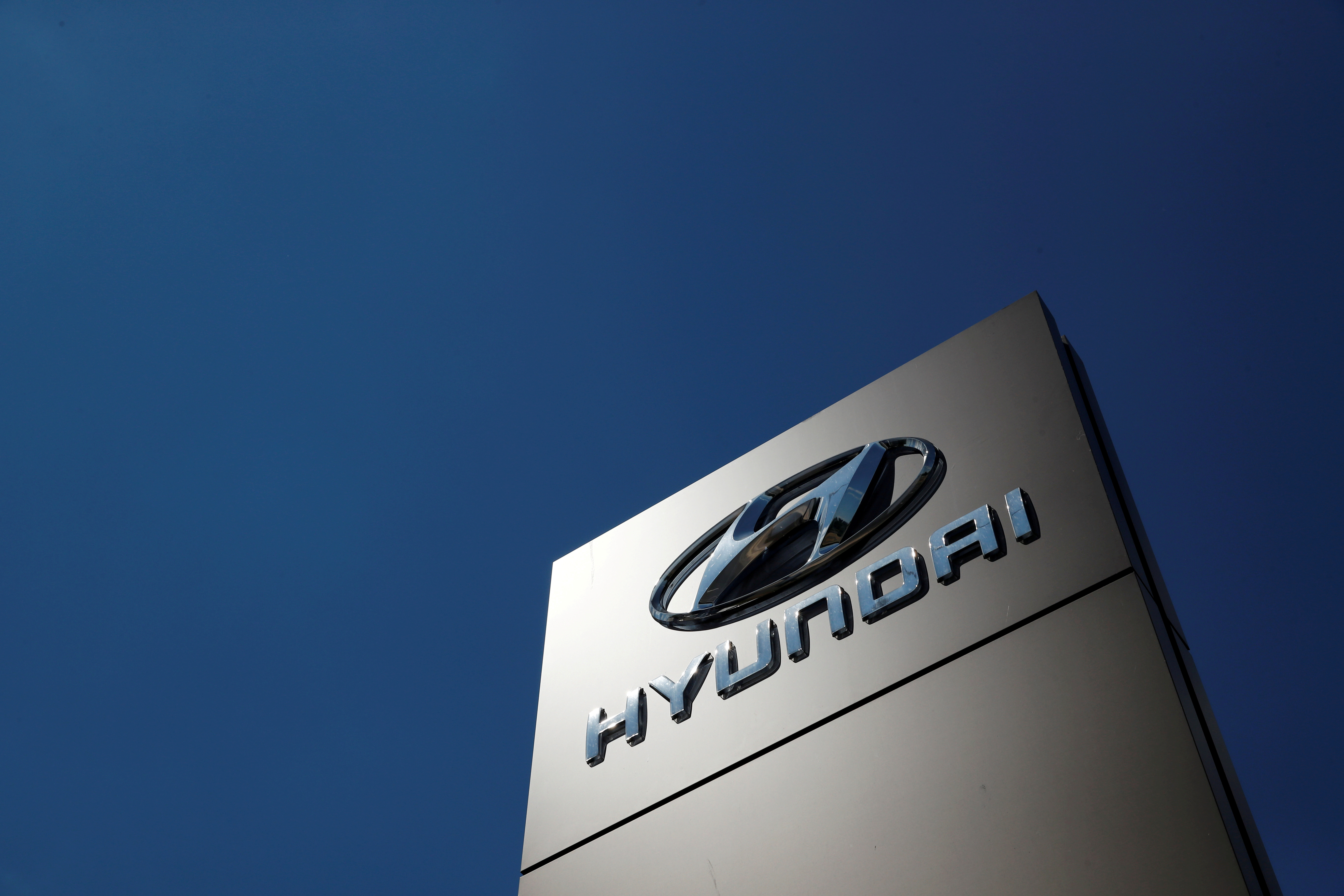 A shop sign of Hyundai is seen outside a car showroom in Bletchley, Milton Keynes, Britain